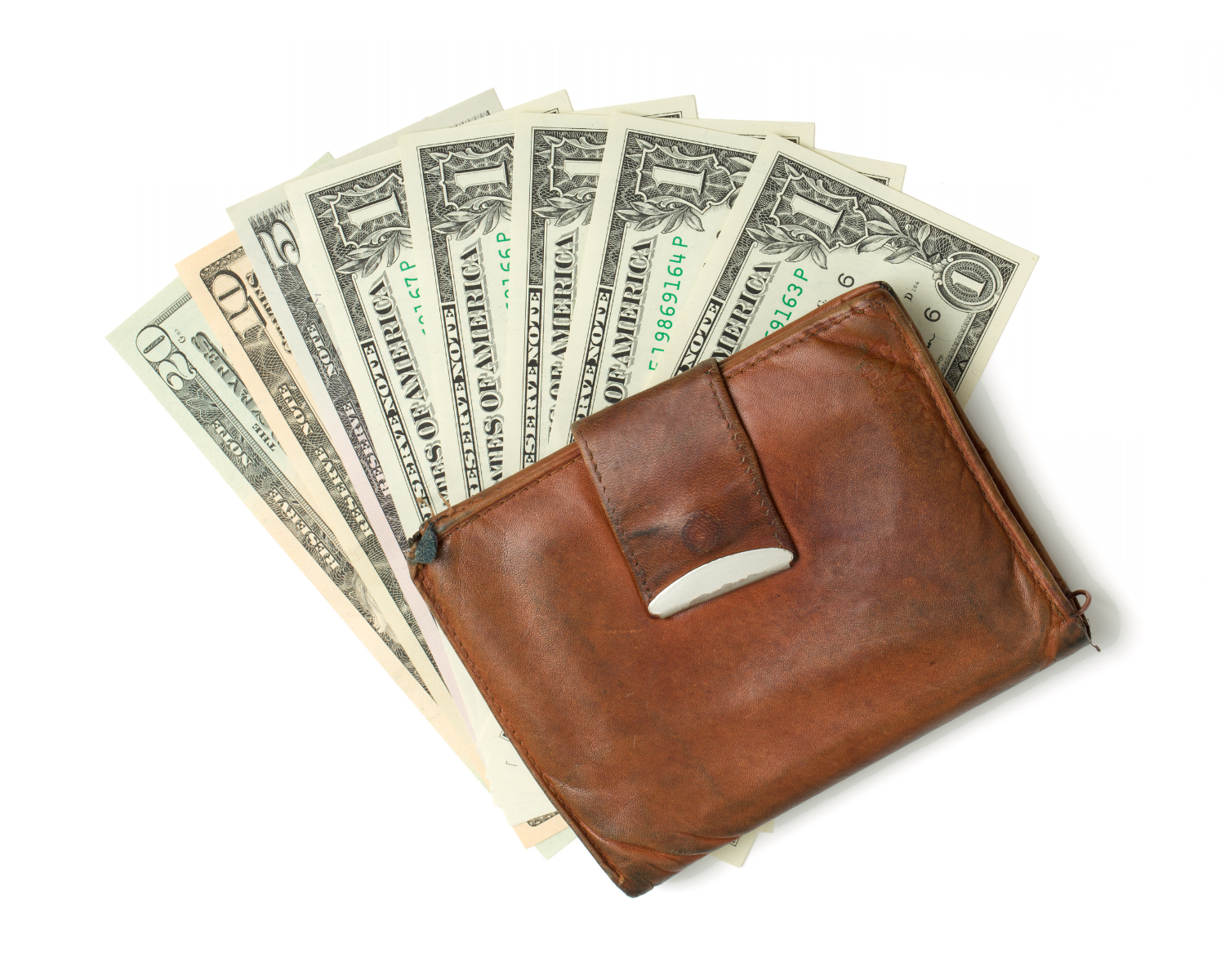 Wallet with several dollar bills on a flat surface.