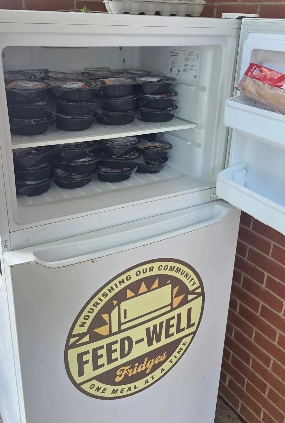 Good Bowls stocked in the freezer of a Feed-Well Fridge.