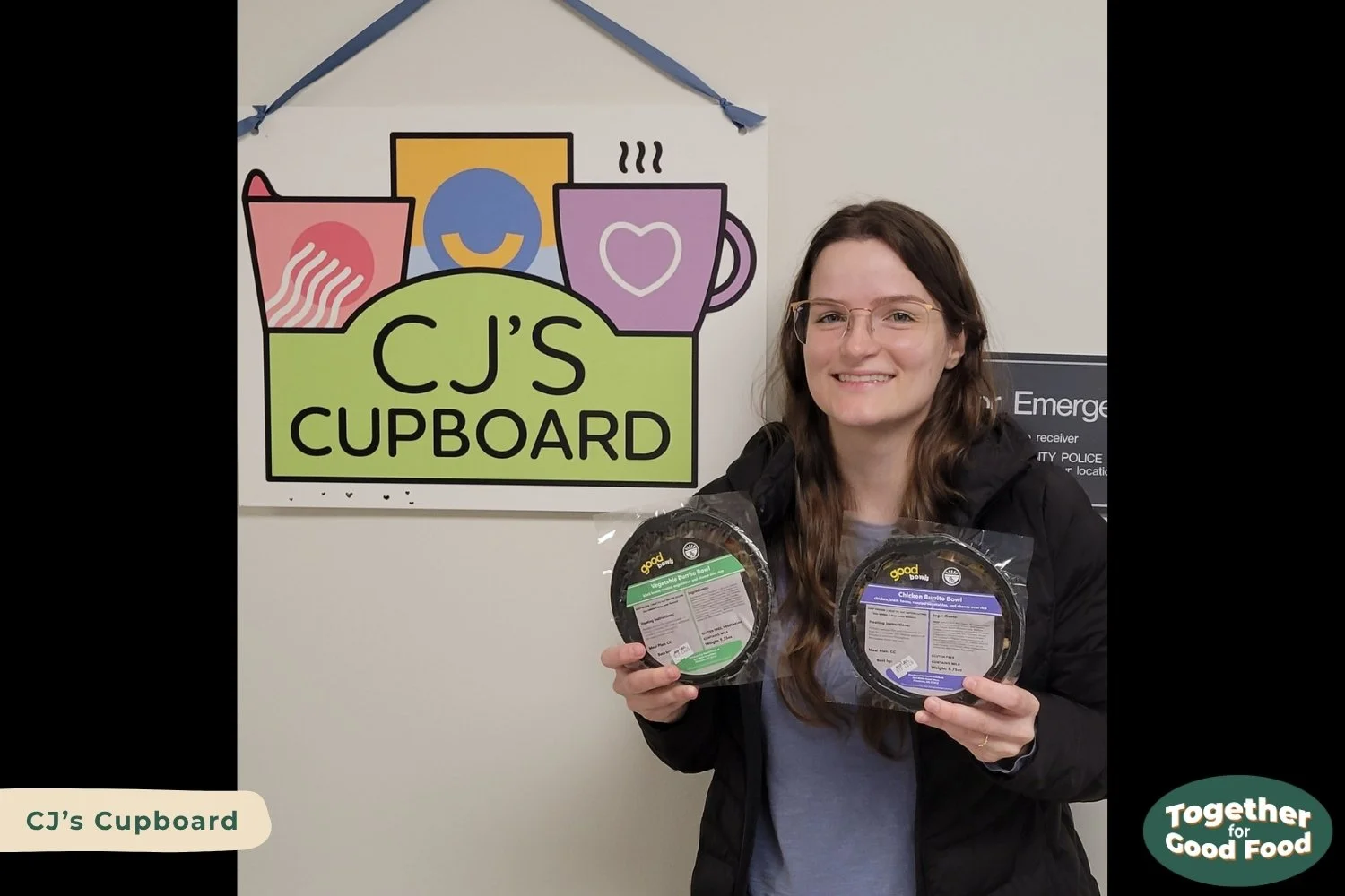 Tori Wierzchowski of Food Equity Collaborative holding two Good Bowls next to the CJ's Cupboard sign. 