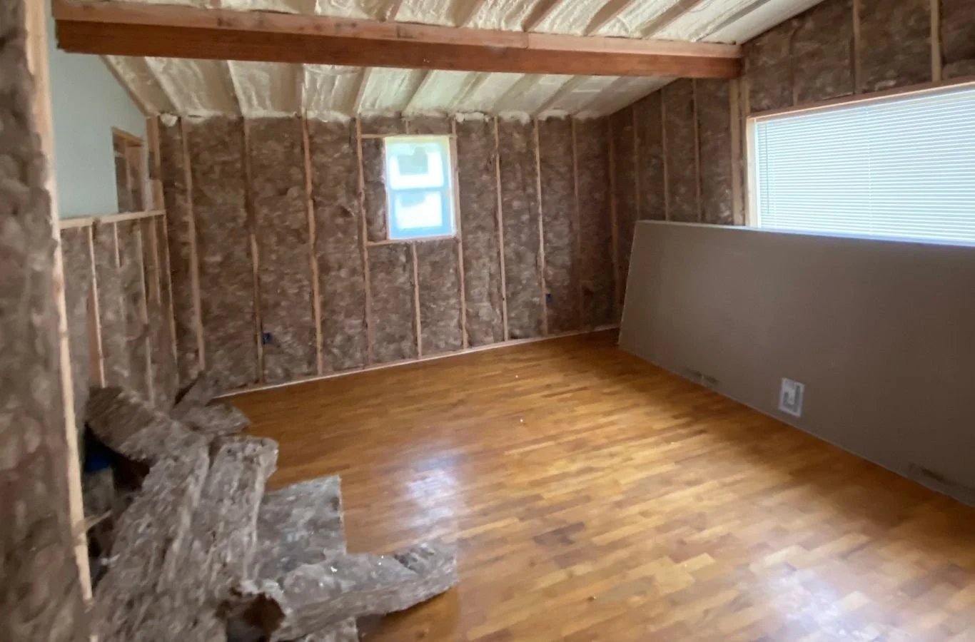 House Crawlers Home Performance & Insulation crew upgrading attic insulation in Lakewood, WA