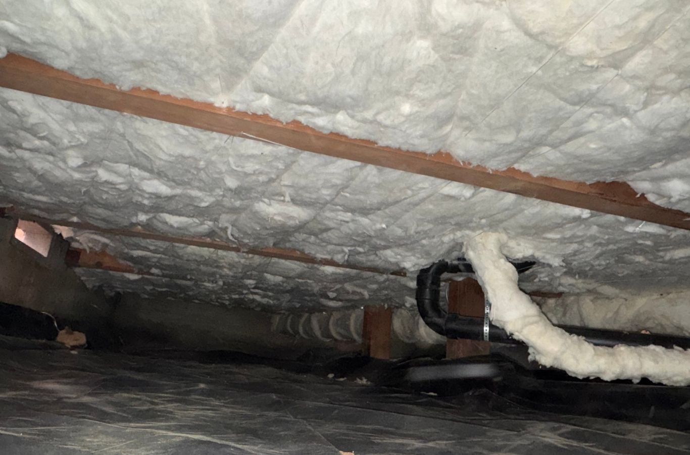 House Crawlers Home Performance & Insulation crew improving crawl space insulation in Spanaway, WA
