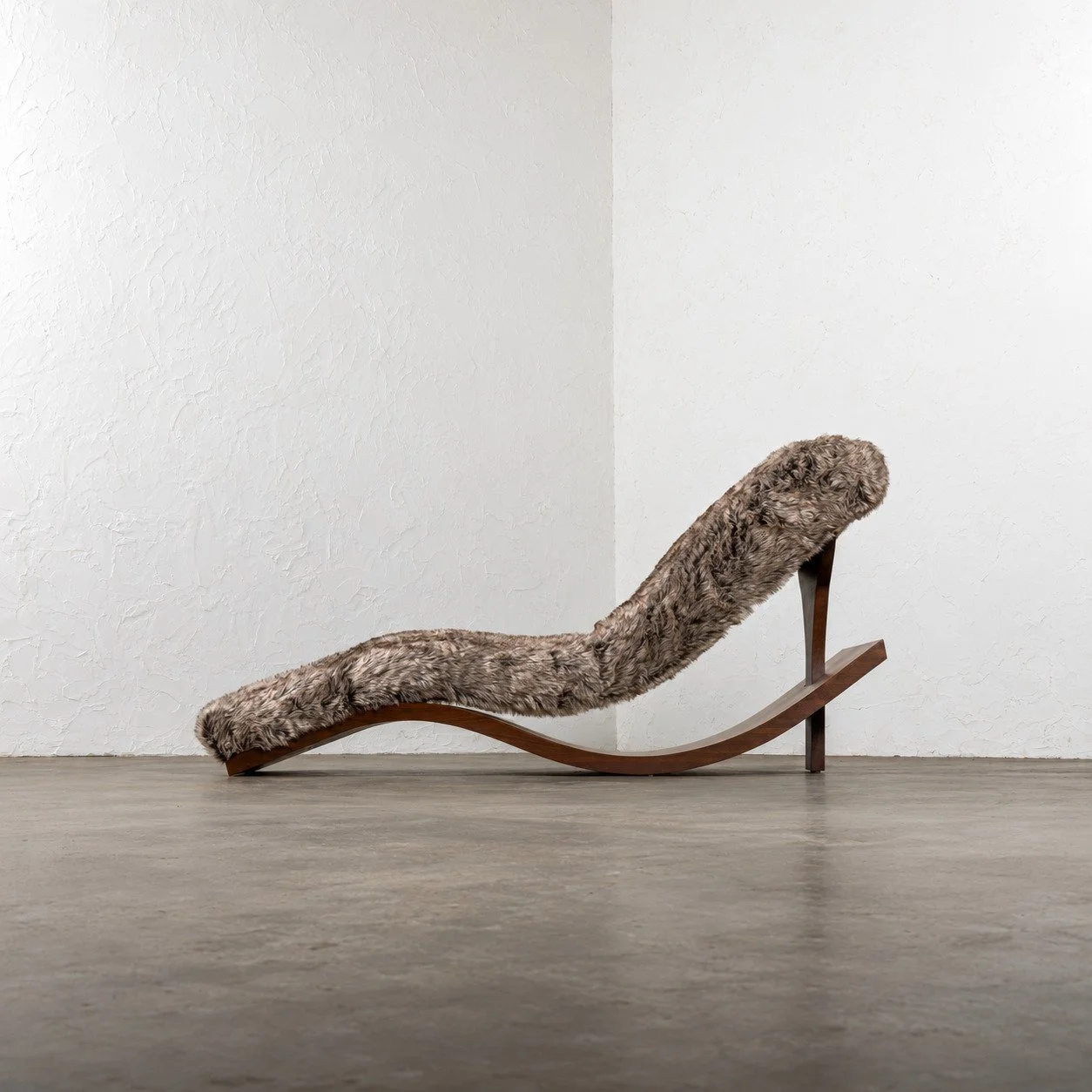 Wave Chaise Lounge - Iteration IV by Nersi Nasseri: Side profile showing the sculptural walnut curve