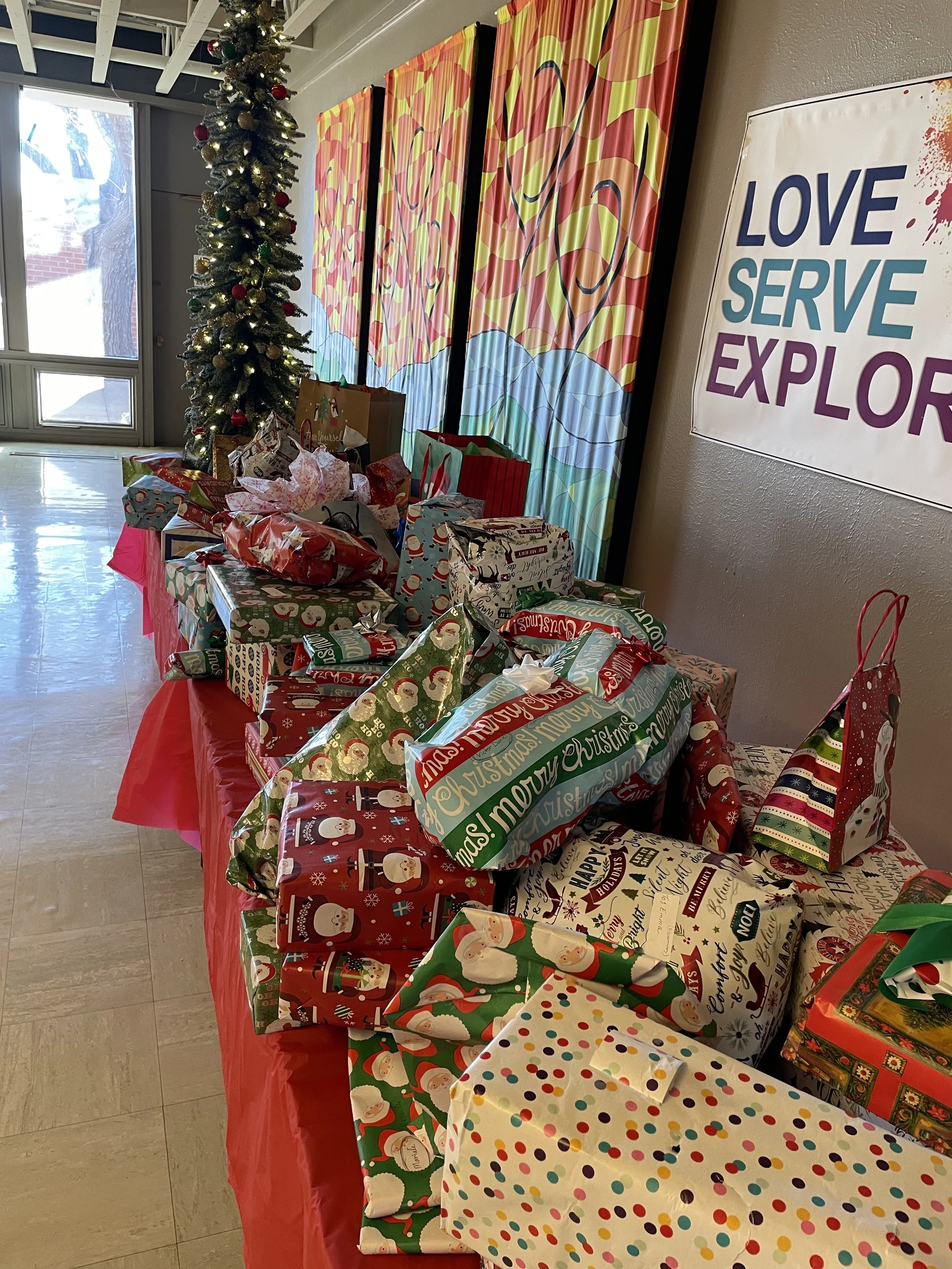 WINGS Christmas - December A community-wide toy drive provided toys (and extras) for all WINGS families and children, the event was hosted by St. Timothy's Church