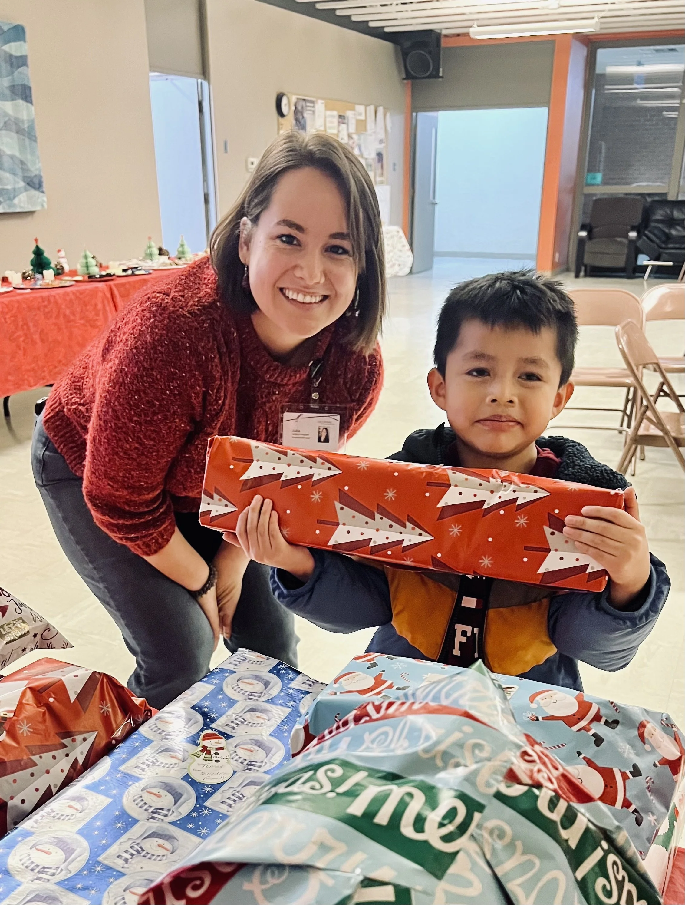 WINGS Christmas - December A community-wide toy drive provided toys (and extras) for all WINGS families and children, the event was hosted by St. Timothy's Church