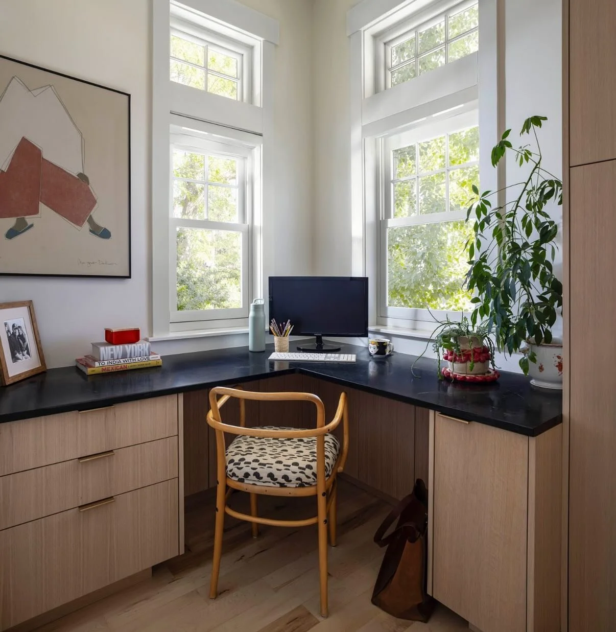Clever.✨ From a packed pantry lacking proper storage to a bright, comfortable office with a place for everything. We added a window and topped the oak cabinetry with a soapstone countertop to complement the black and oak kitchen we designed around th