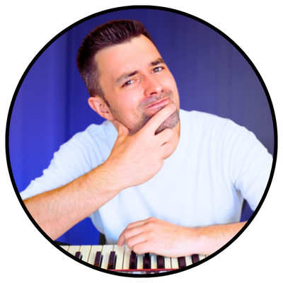 The Keys Coach Adam Saunders - Wearing a white t-shirt on a blue background.