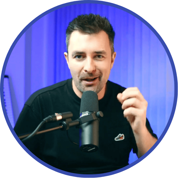 The Keys Coach Adam Saunders - Wearing a black t-shirt on a blue background.