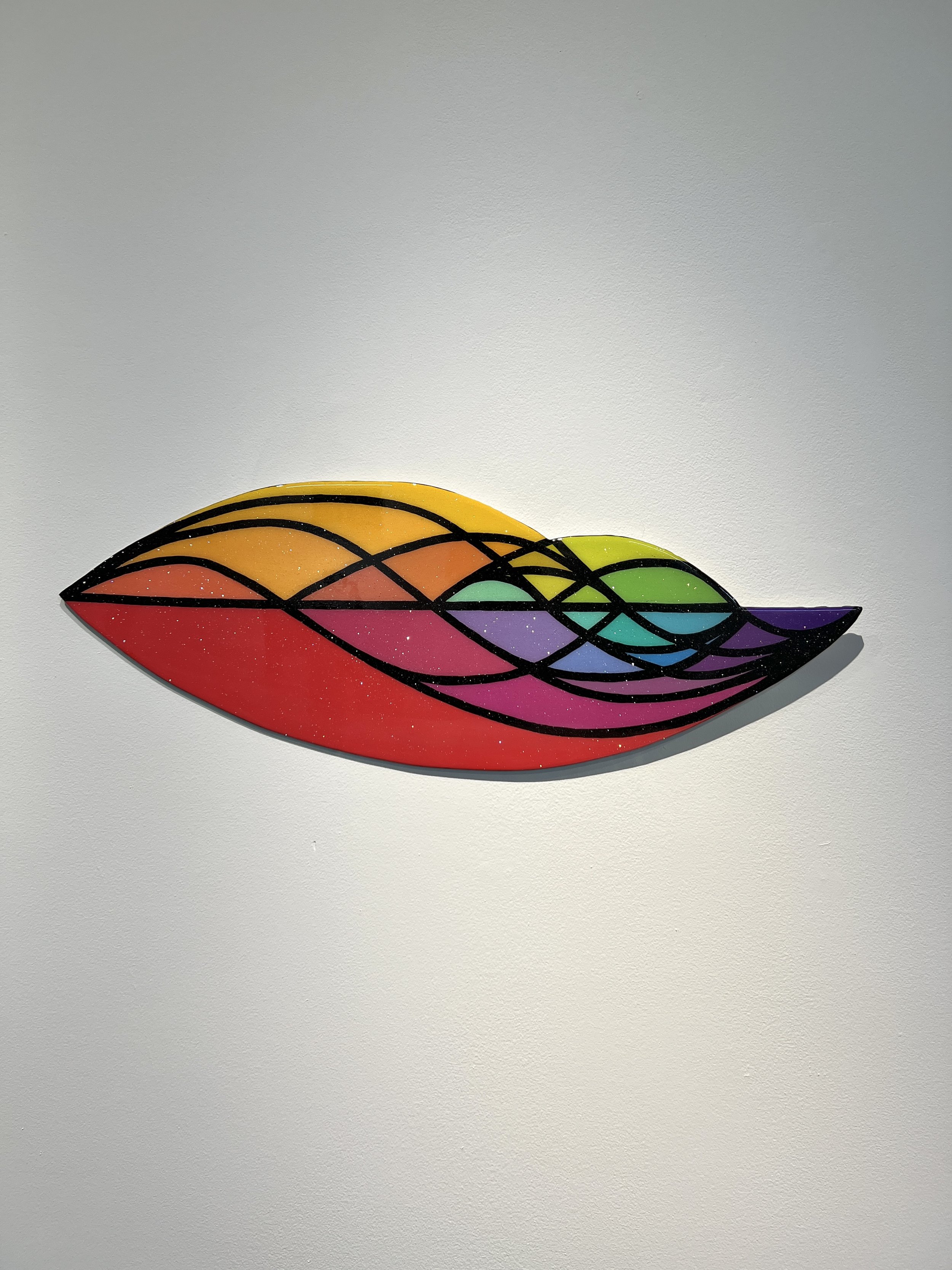Colorful abstract wave-shaped artwork on wall