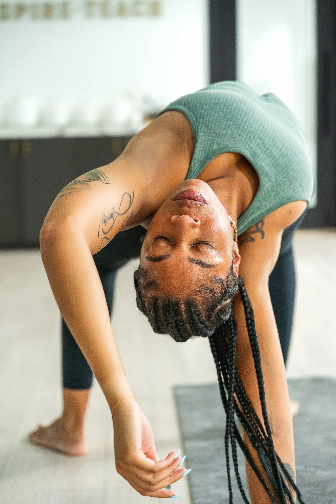 Black yoga instructor does wild thing with a peaceful expression