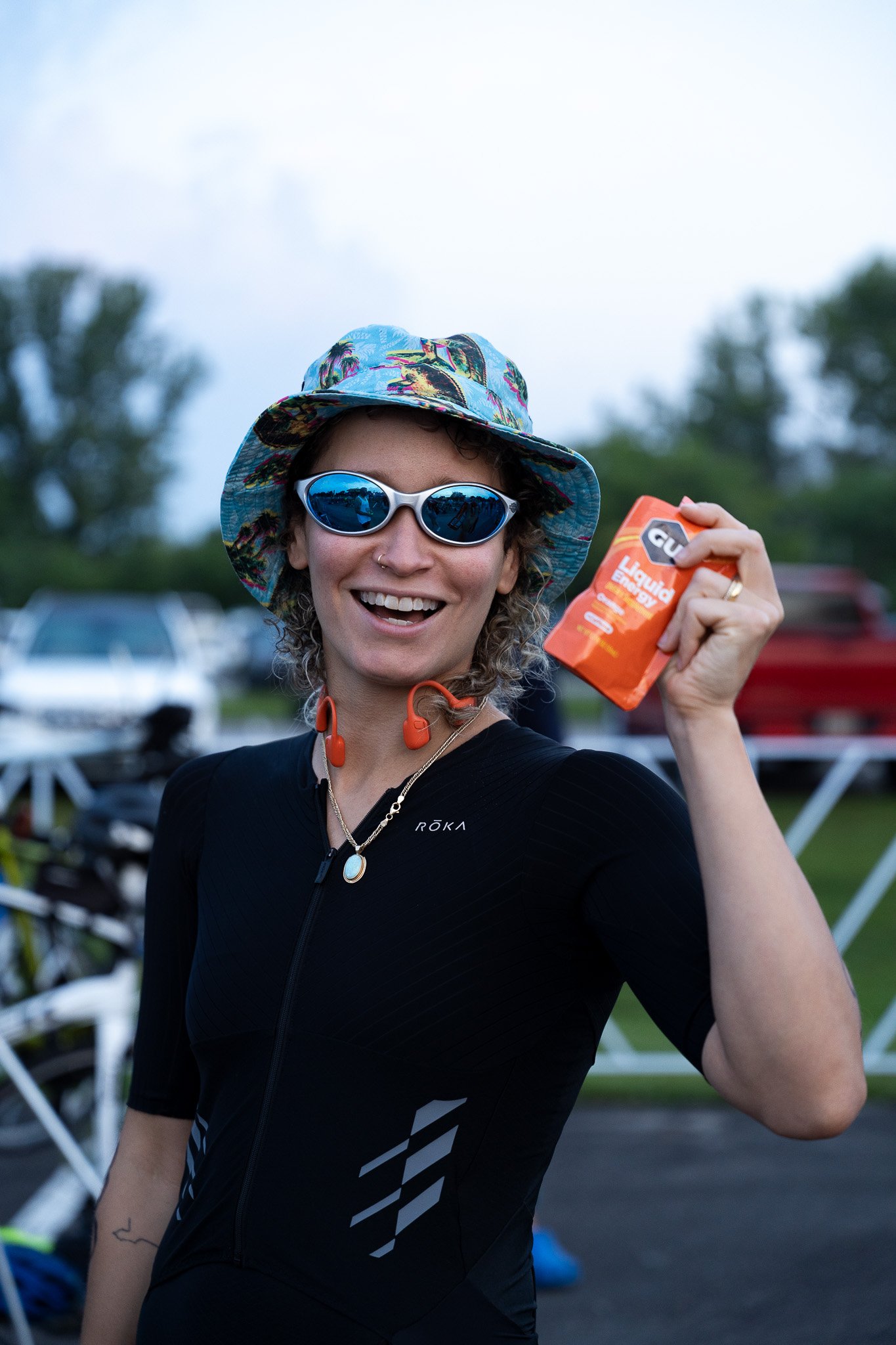 Triathlete holding up a Gu packet