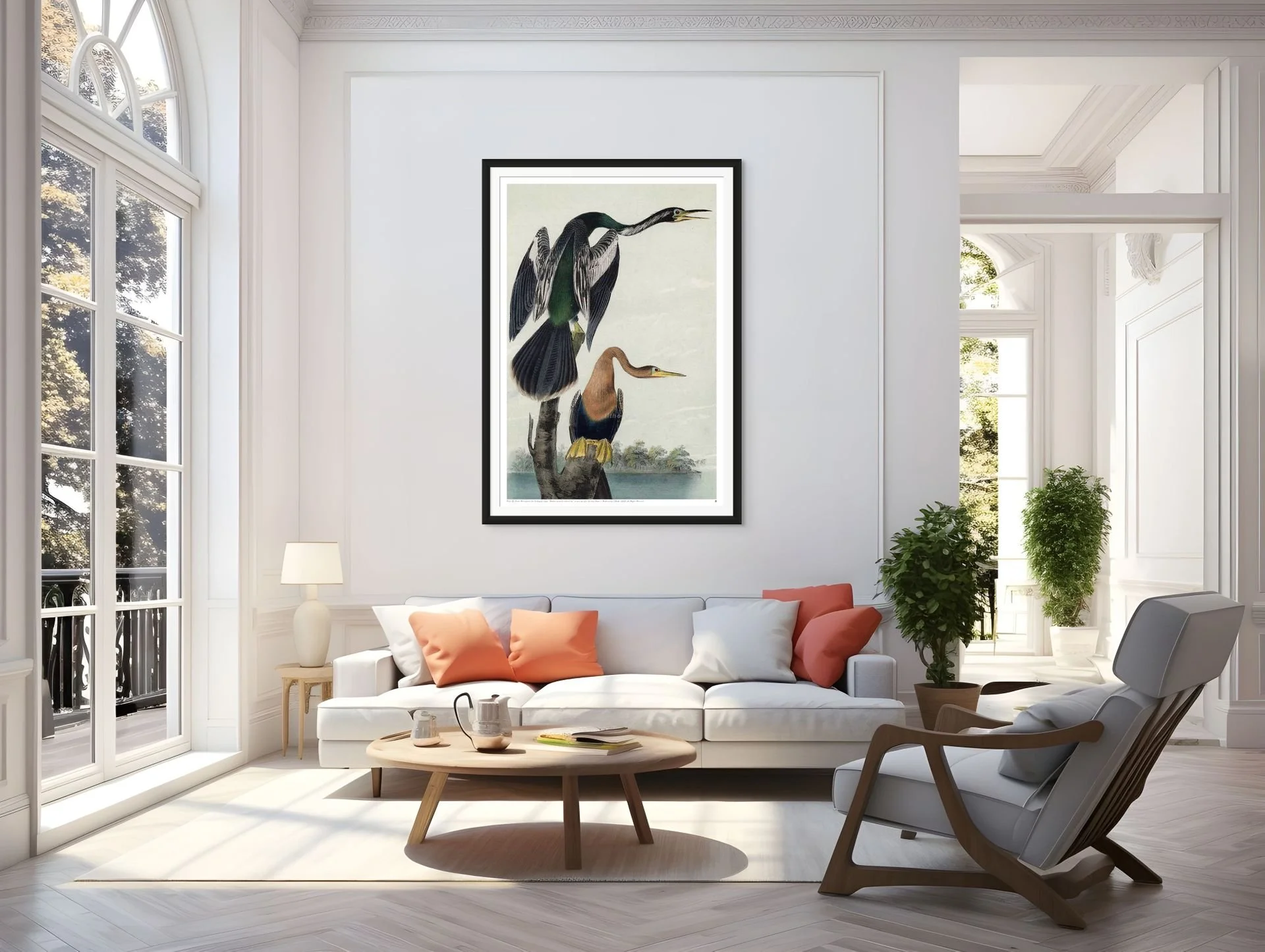 Living room with white walls, large windows, white sofa with orange and white pillows, wood coffee table with cups and notebooks, framed artwork of birds hanging on the wall, potted plants, and a modern armchair.