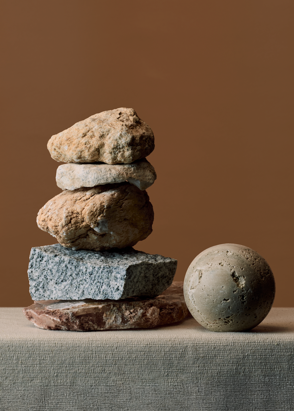 Stack of unique, organic stones that symbolize the unchartered journey of building a business in unknown times, but that the next step for a sustainable, bright future that is true to vision is possible.