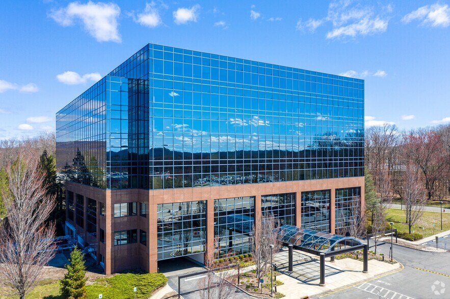 Exterior entrance area of the office building at 100 Enterprise Drive in Rockaway, New Jersey