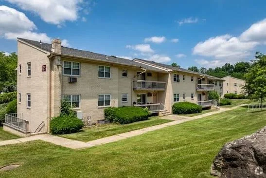 Apartment complex with a green lawn, a residential setting where Barreto Law Firm helps with injuries in the Netcong area