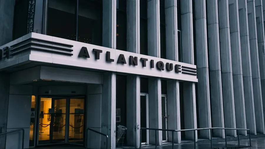 Entrance of the Atlantique building with stone columns, a property owner's premises liability responsibility