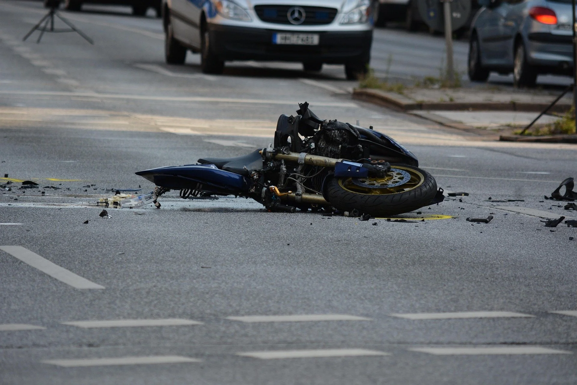 Crashed motorcycle lying on the road after a motorcycle accident caused by a driver failing to see the rider
