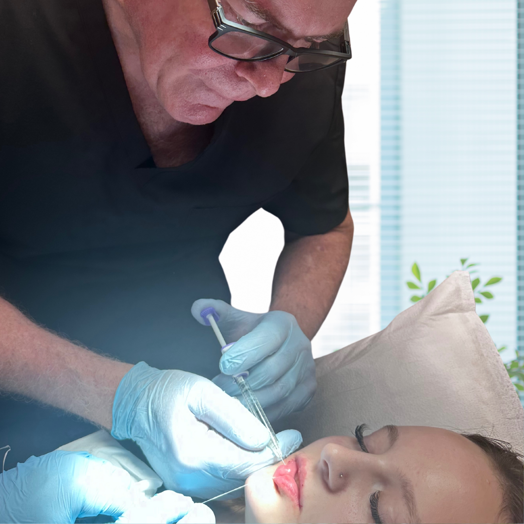 Dr Wright performing lip filler treatment