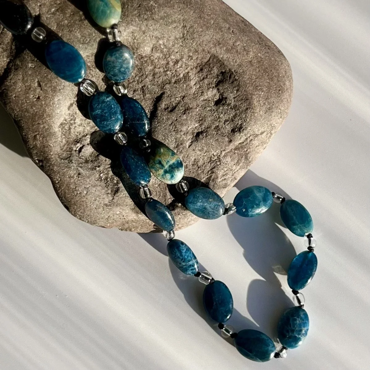a blue necklace made of Apatite beads