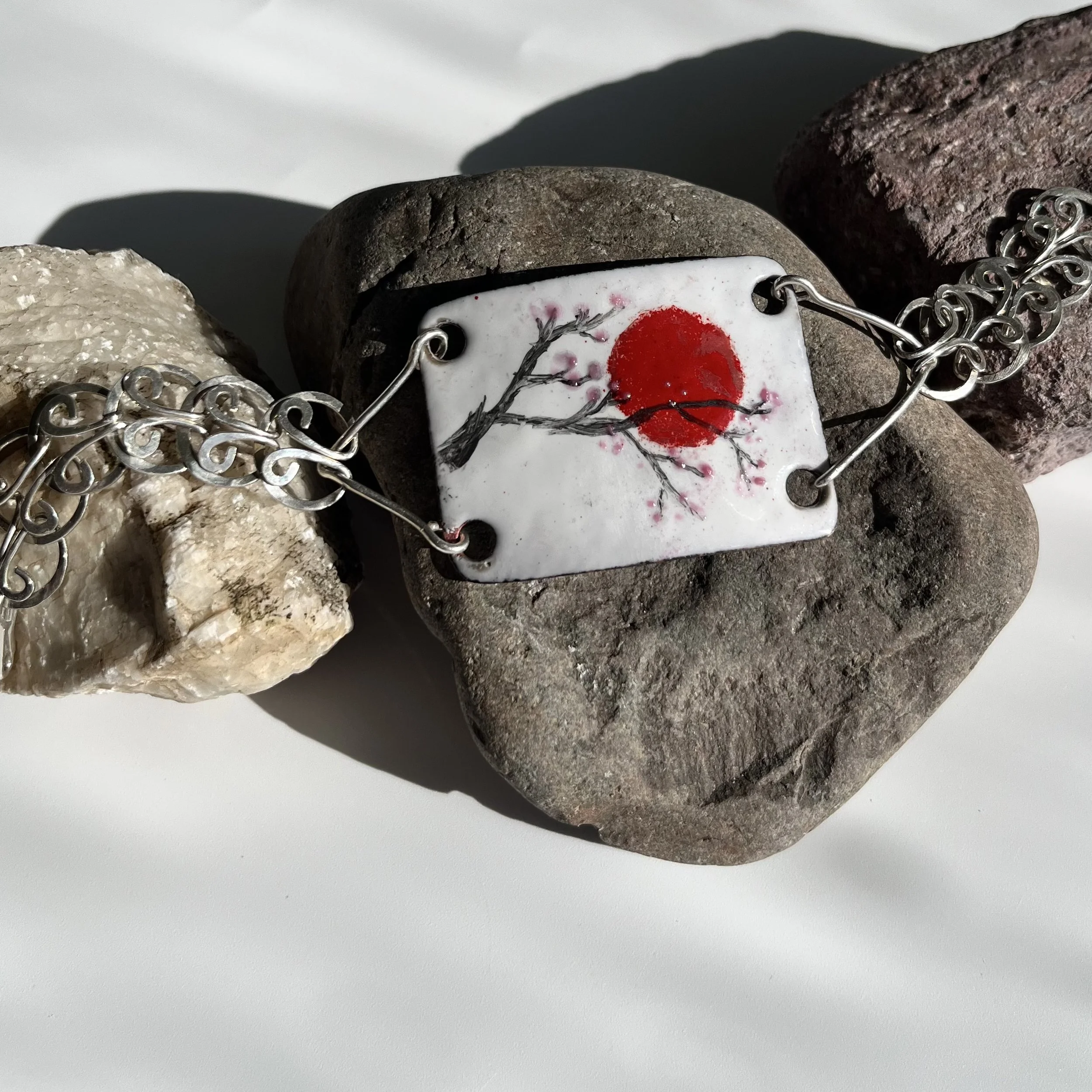 Hand knotted sunset Iolite blue beaded necklace with enameled copper charm on sterling silver accents