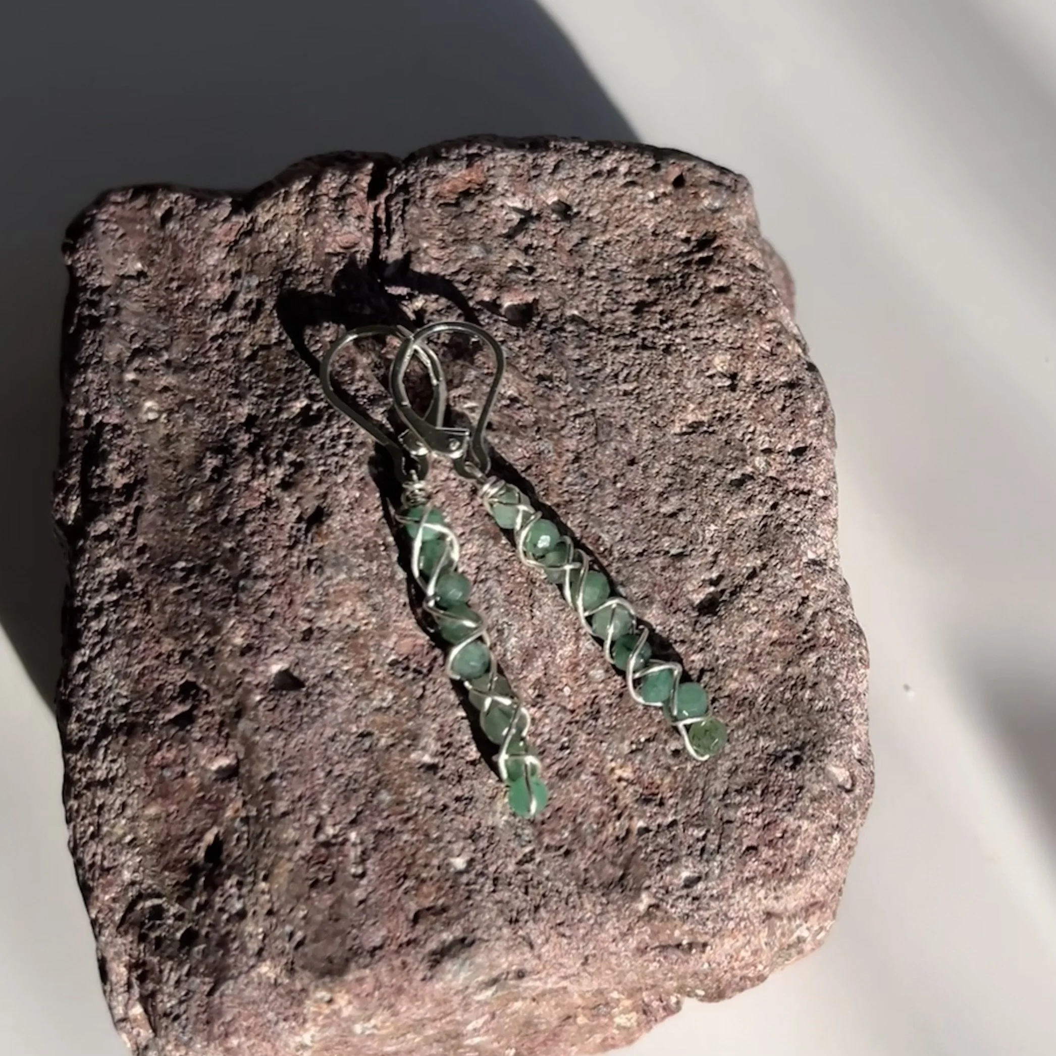 earrings of tiny emerald beads wrapped in silver