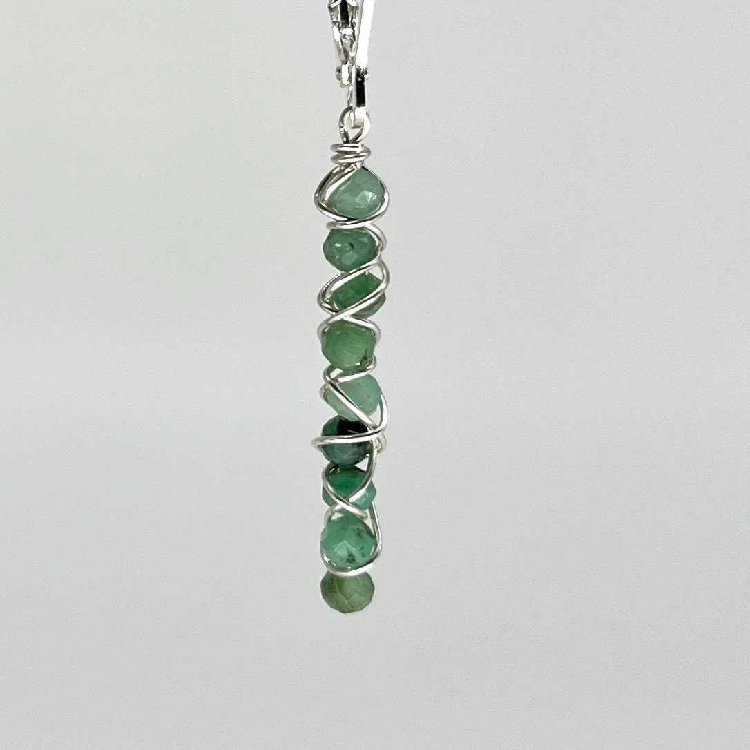 sterling silver wire wrapped emerald earrings.