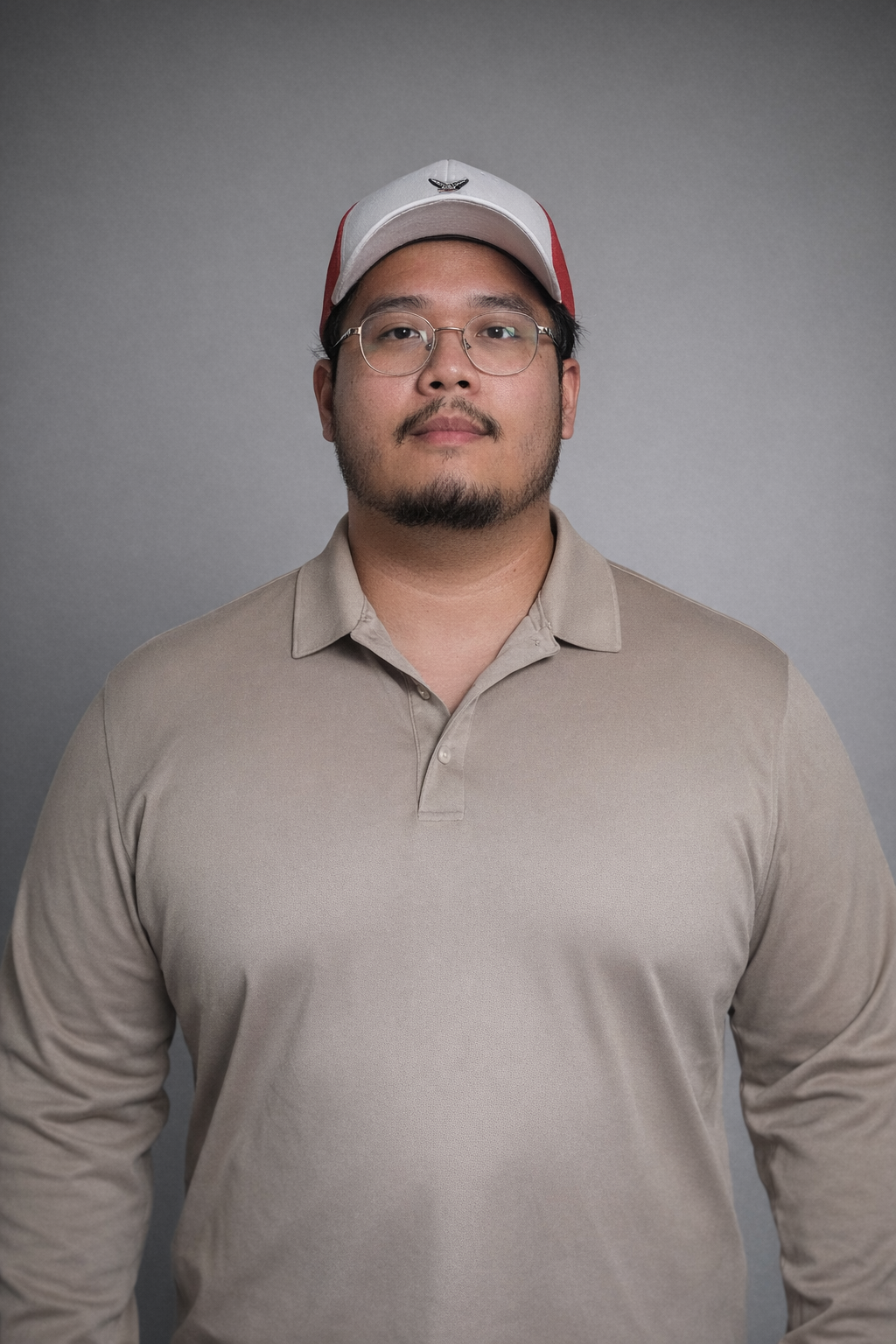 Hobert Jiang professional pest control technician portrait wearing uniform and cap