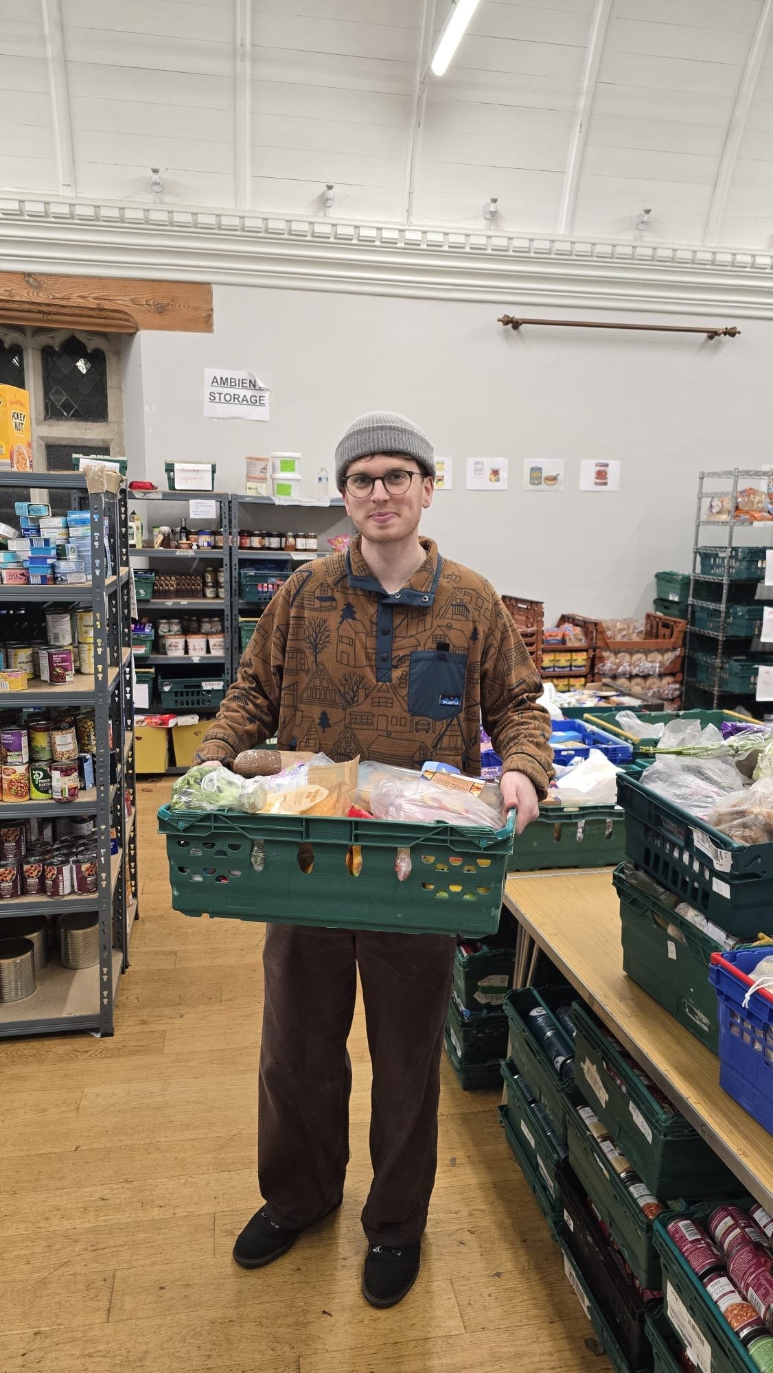 volunteer holding food parcel