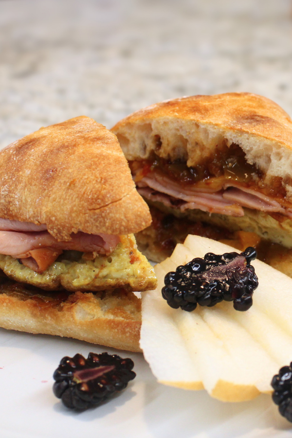 Griddled ham with scrambled eggs, sweet-spicy pepper jam, and cheddar cheese available in a gluten free option