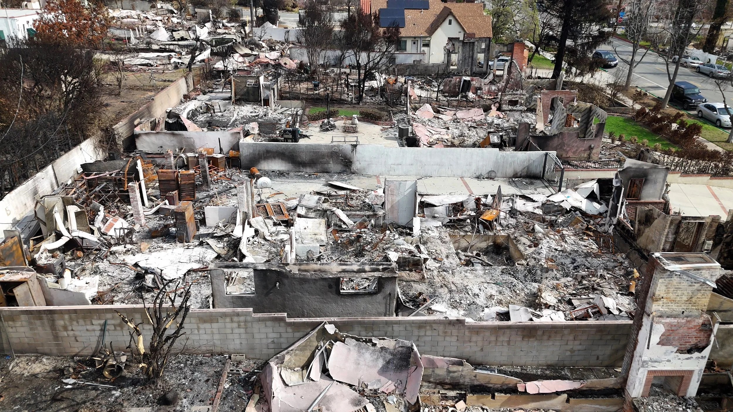 Drone aerial documentation of fire-damaged residential properties in Altadena, California, following the Eaton Fire.