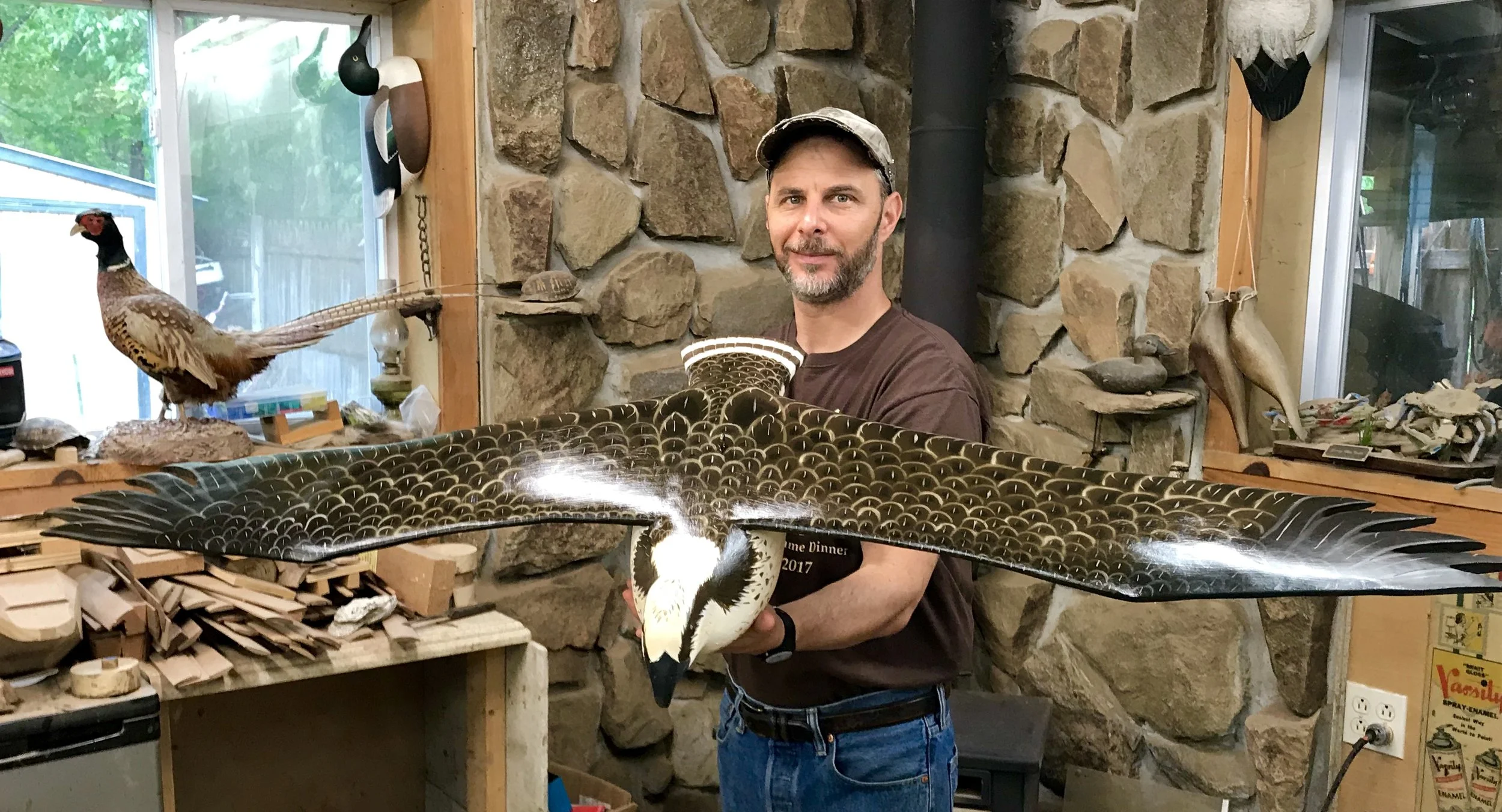 Carer Jode Hillman with full sized carved Osprey.