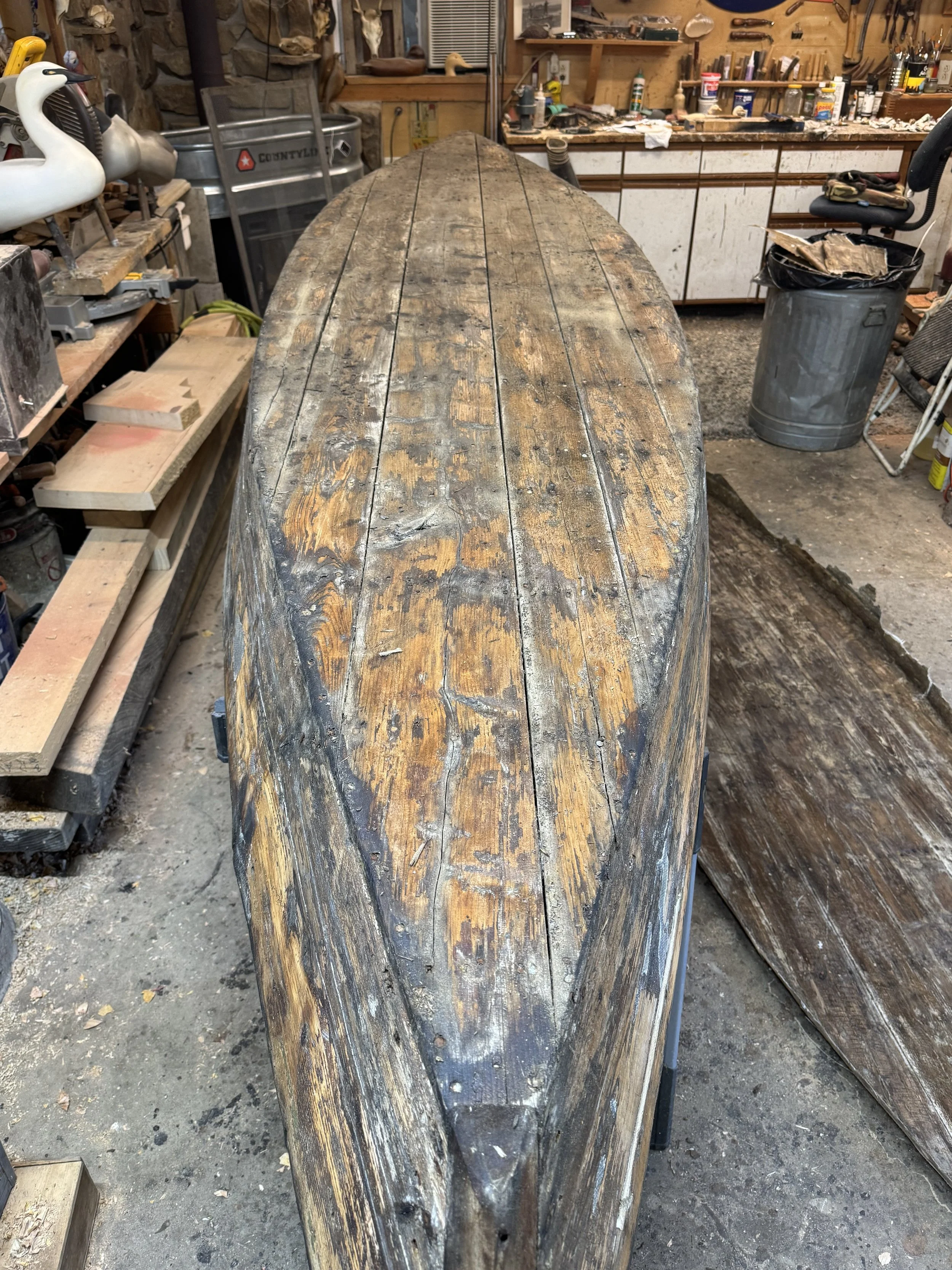 old fiberglass removed, showing cedar planking.