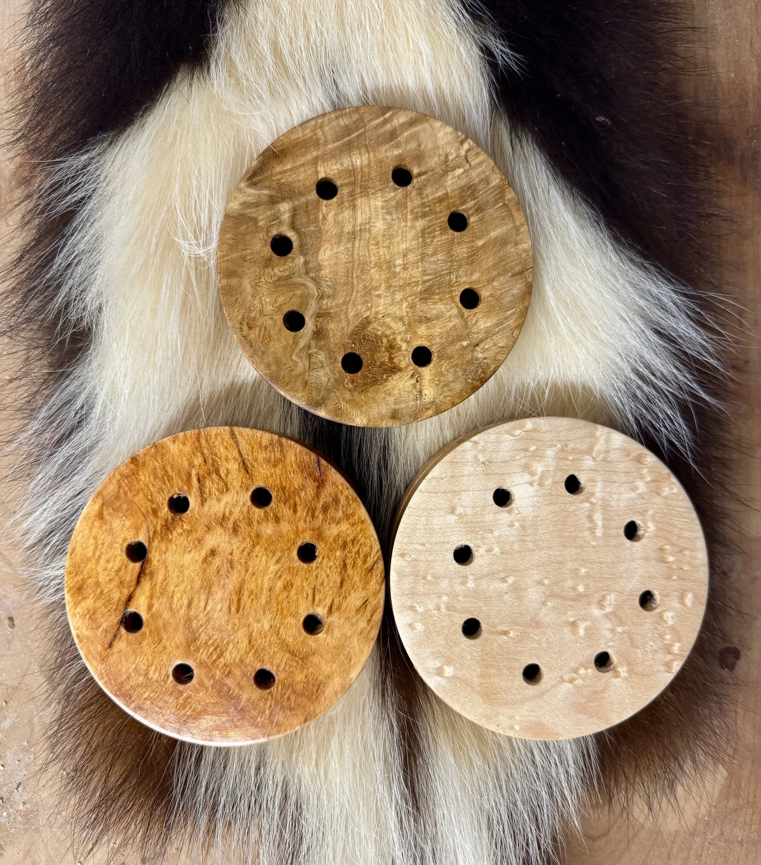 Trio of Slate pot calls, Clockwise from top, White Oak Burl, Birds-eye Maple, White Cedar Burl. 