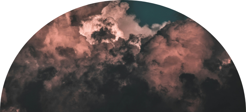 Clouds in a sunset sky with shades of pink and dark gray