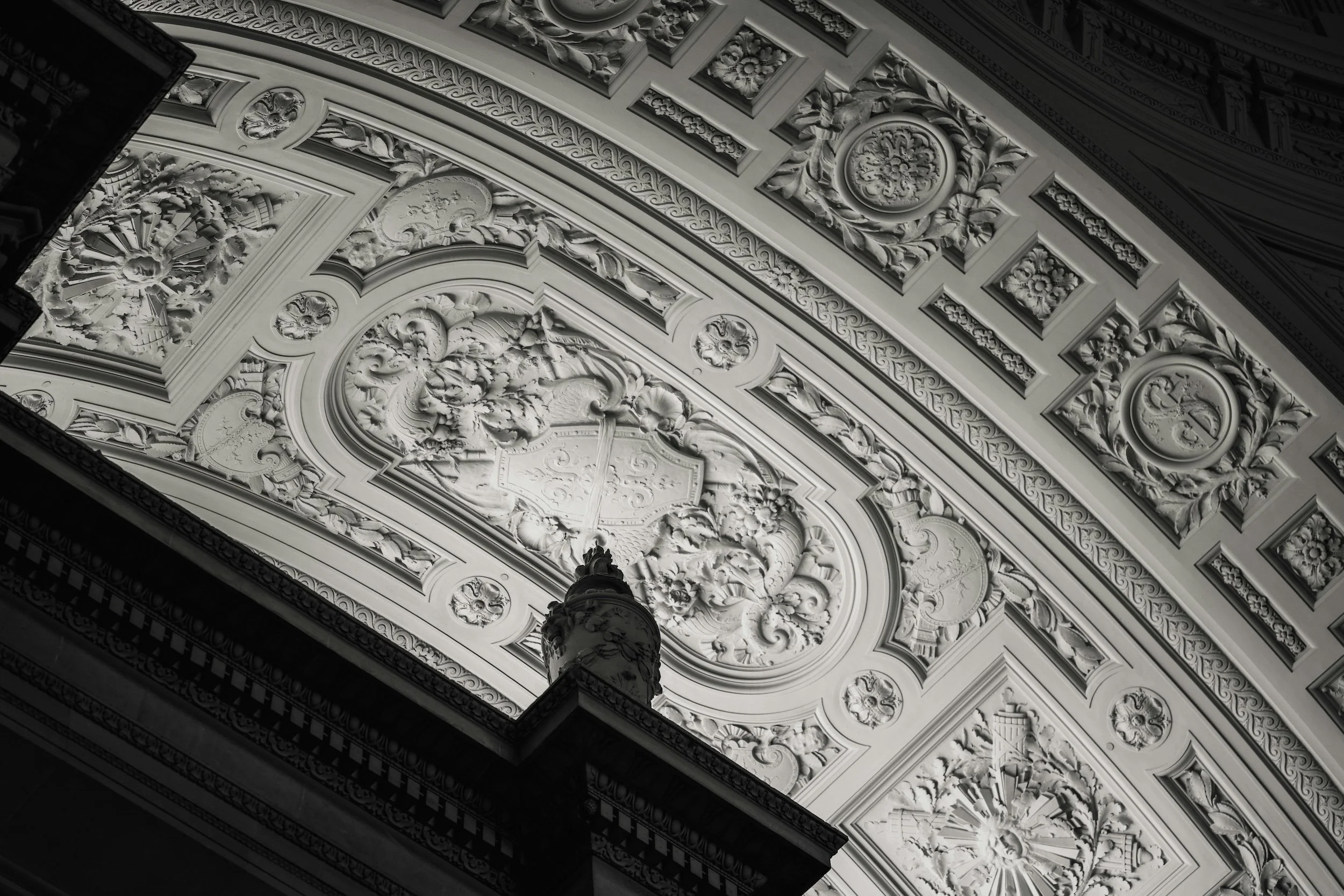 High end kitchen and interior design Fairfield County CT & Charlotte, NC: black-and-white photo of ornate classical ceiling moldings and detailed plasterwork.