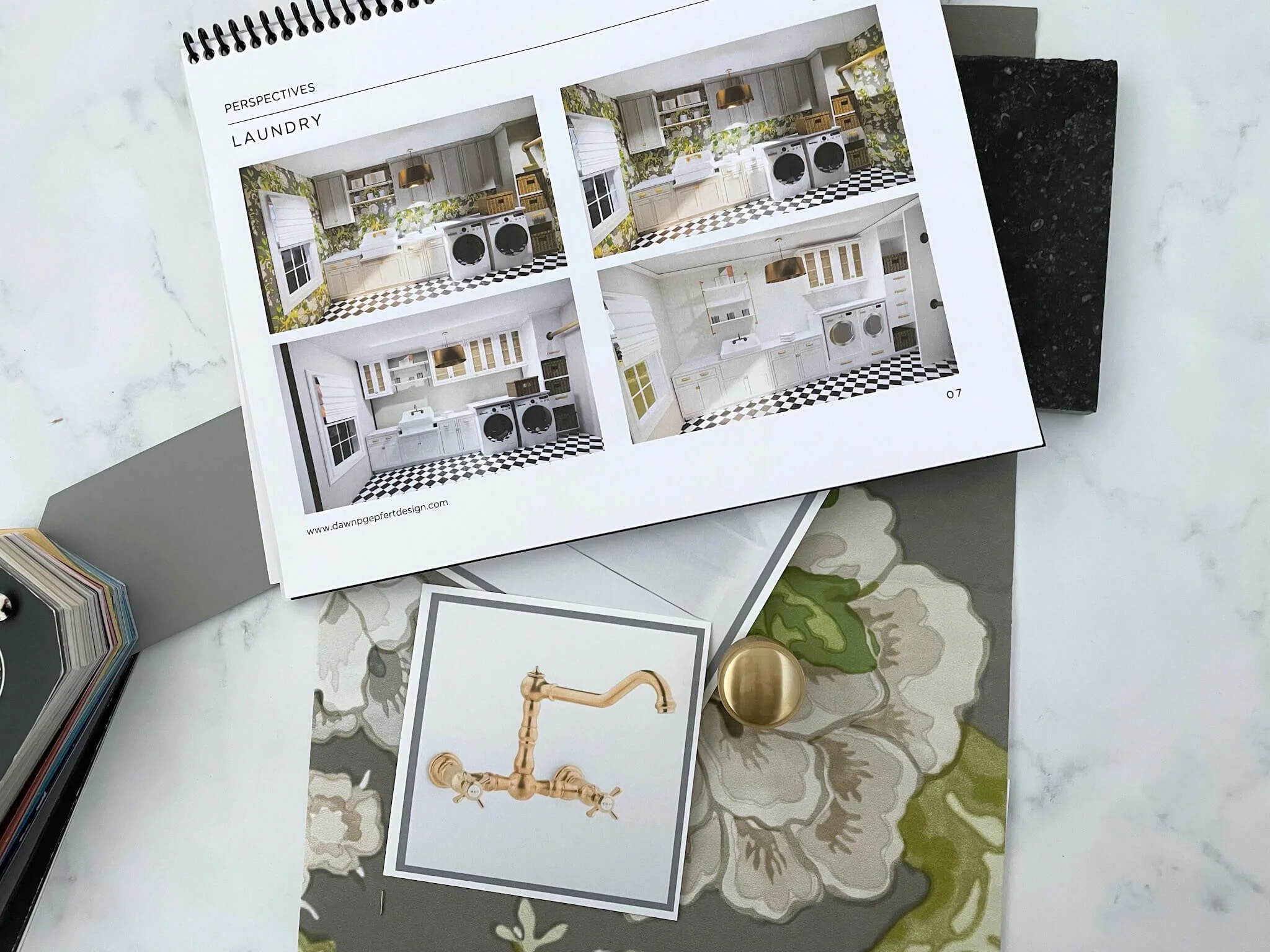 Interior design presentation showing laundry room renderings in a spiral-bound booklet by Dawn P. Gepfert Design.