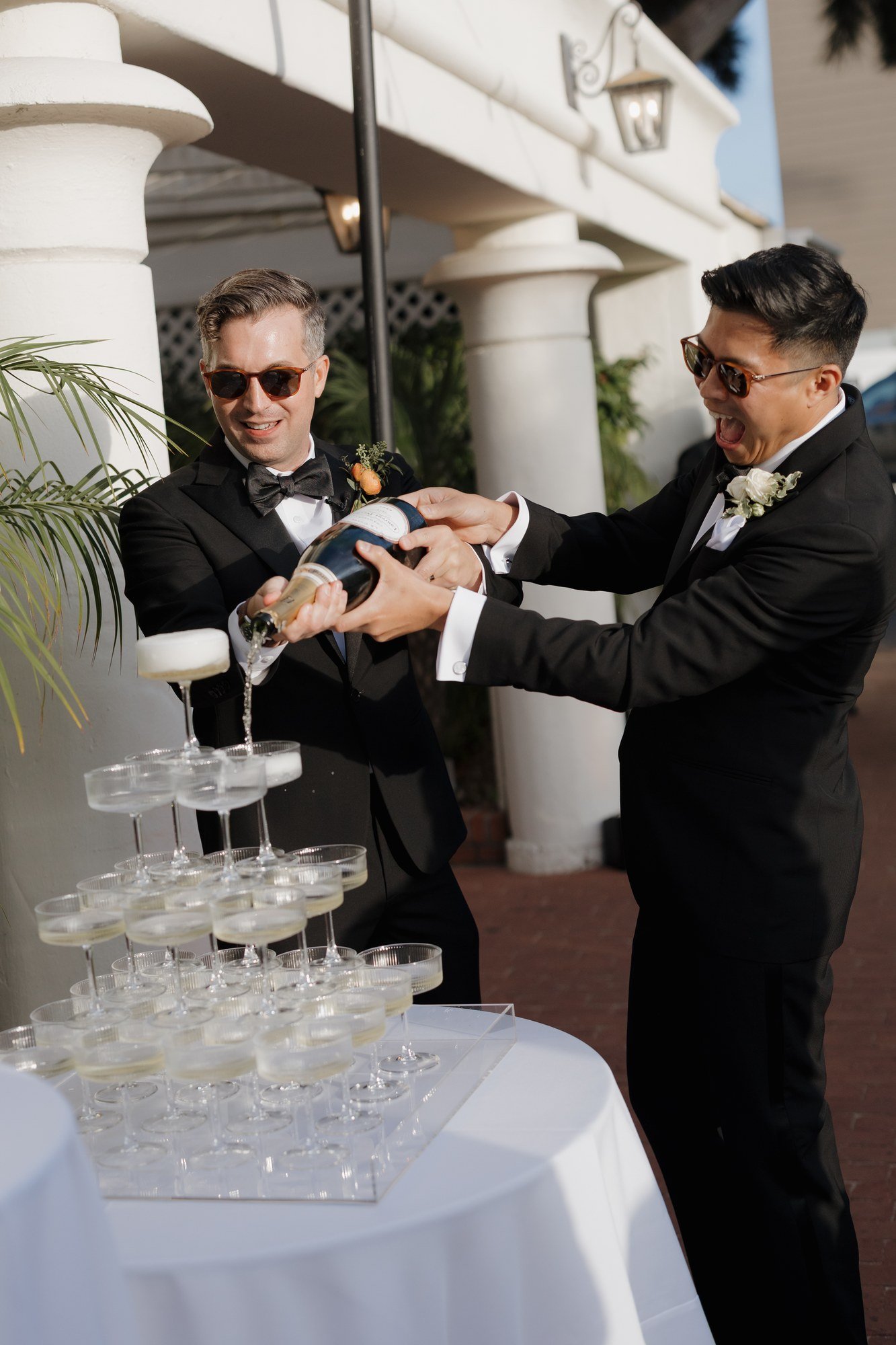 Ryan and Sean pouring their champagne tower at their Darlington House reception
