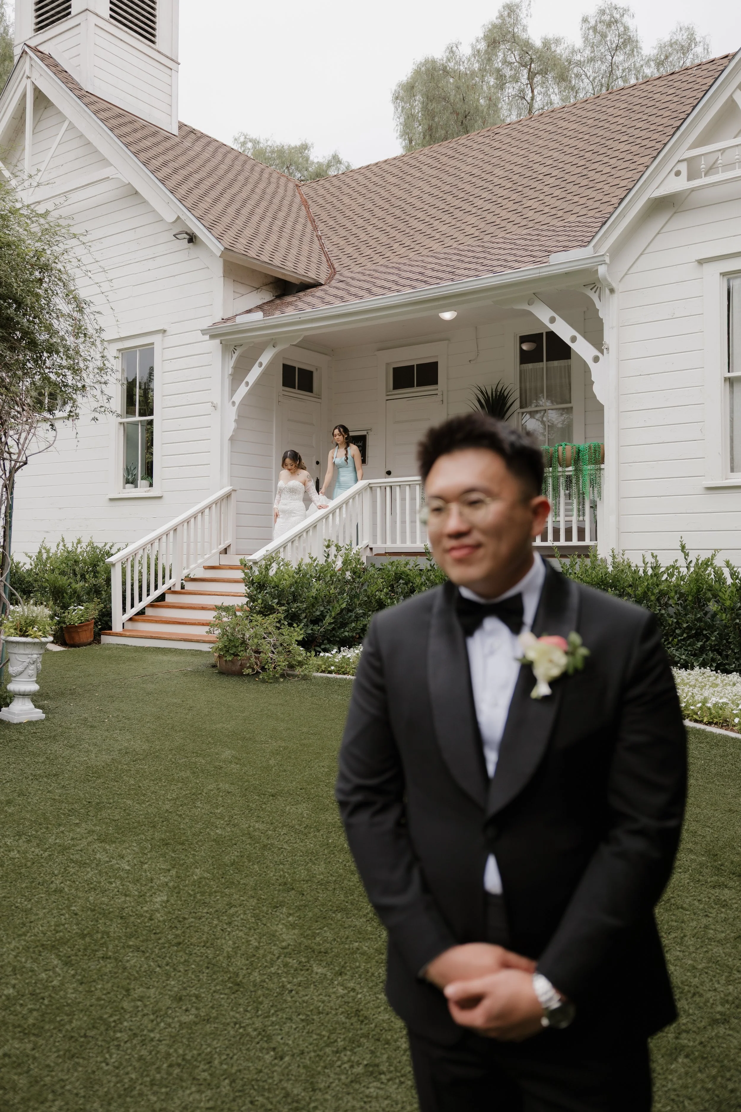 Ken waiting in his tuxedo for the first look in front of the Green Gables schoolhouse