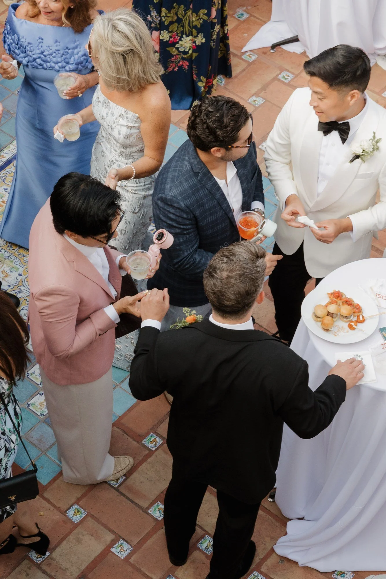 Ryan greeting guests over appetizers at cocktail hour at Darlington House
