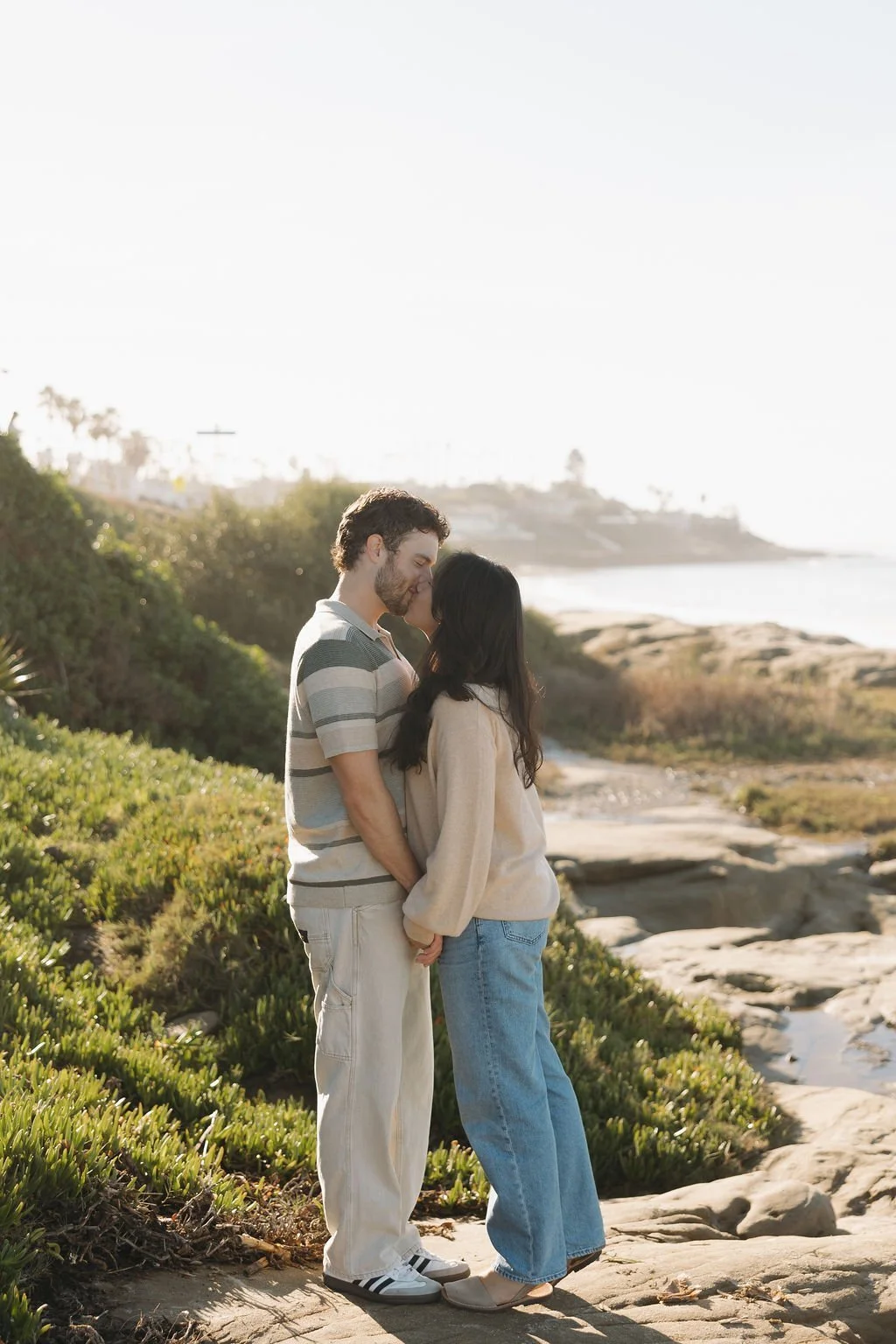 Couple among coastal greenery at Windansea Beach