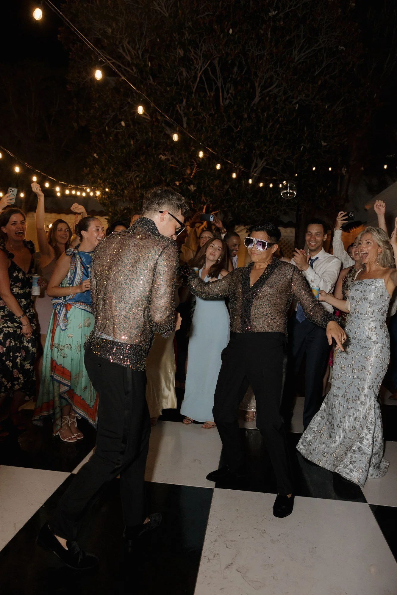 Ryan and Sean dancing late into the night under string lights at Darlington House