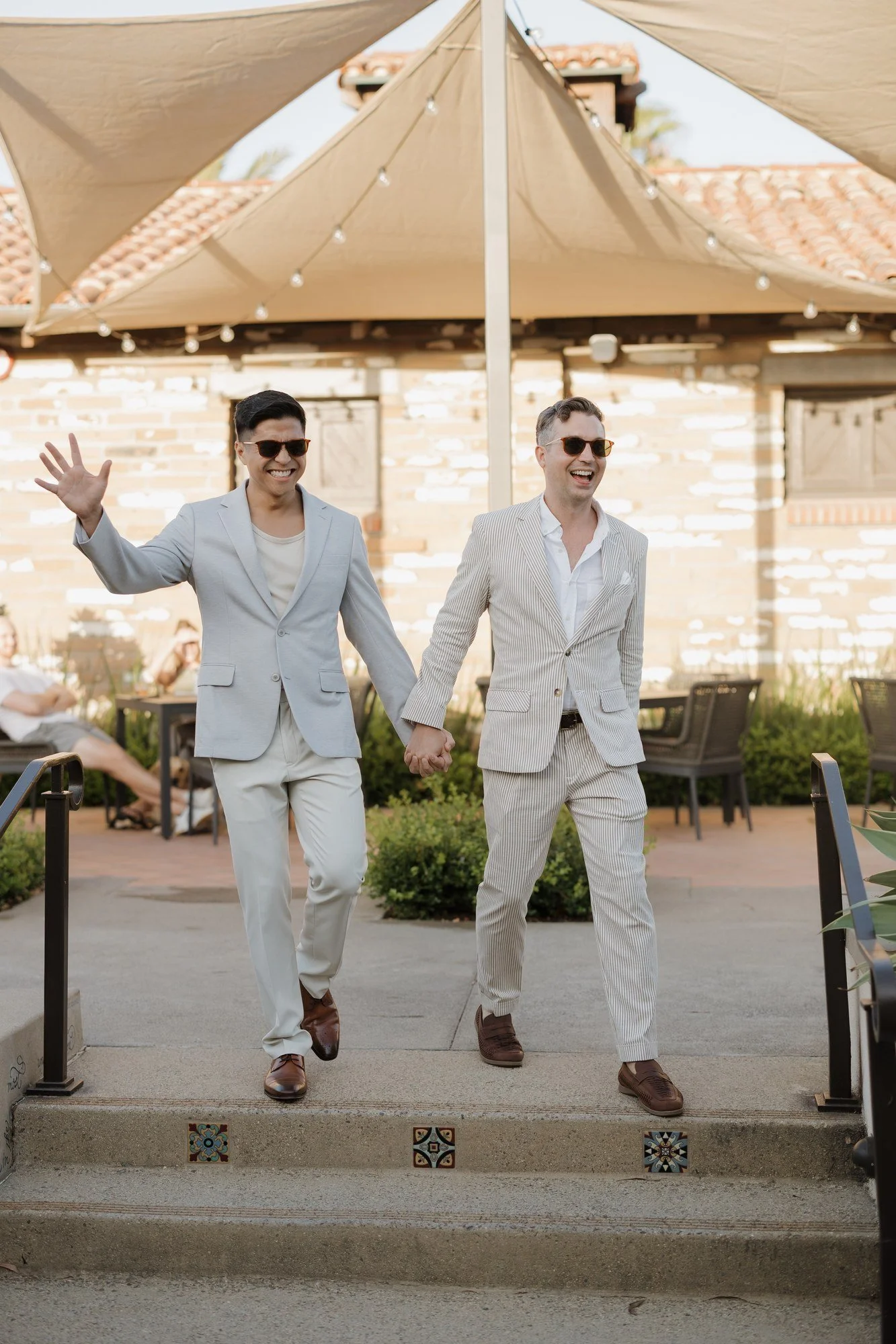 Ryan and Sean making a celebratory entrance to their rehearsal dinner at Estancia La Jolla