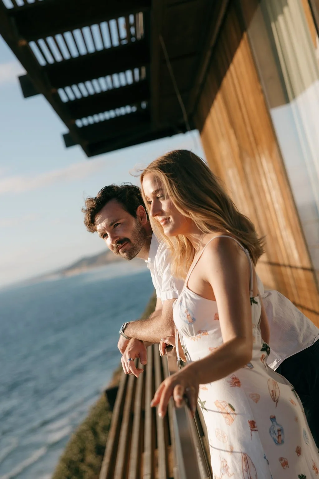 Candid close moment on an ocean-view balcony near Scripps Pier