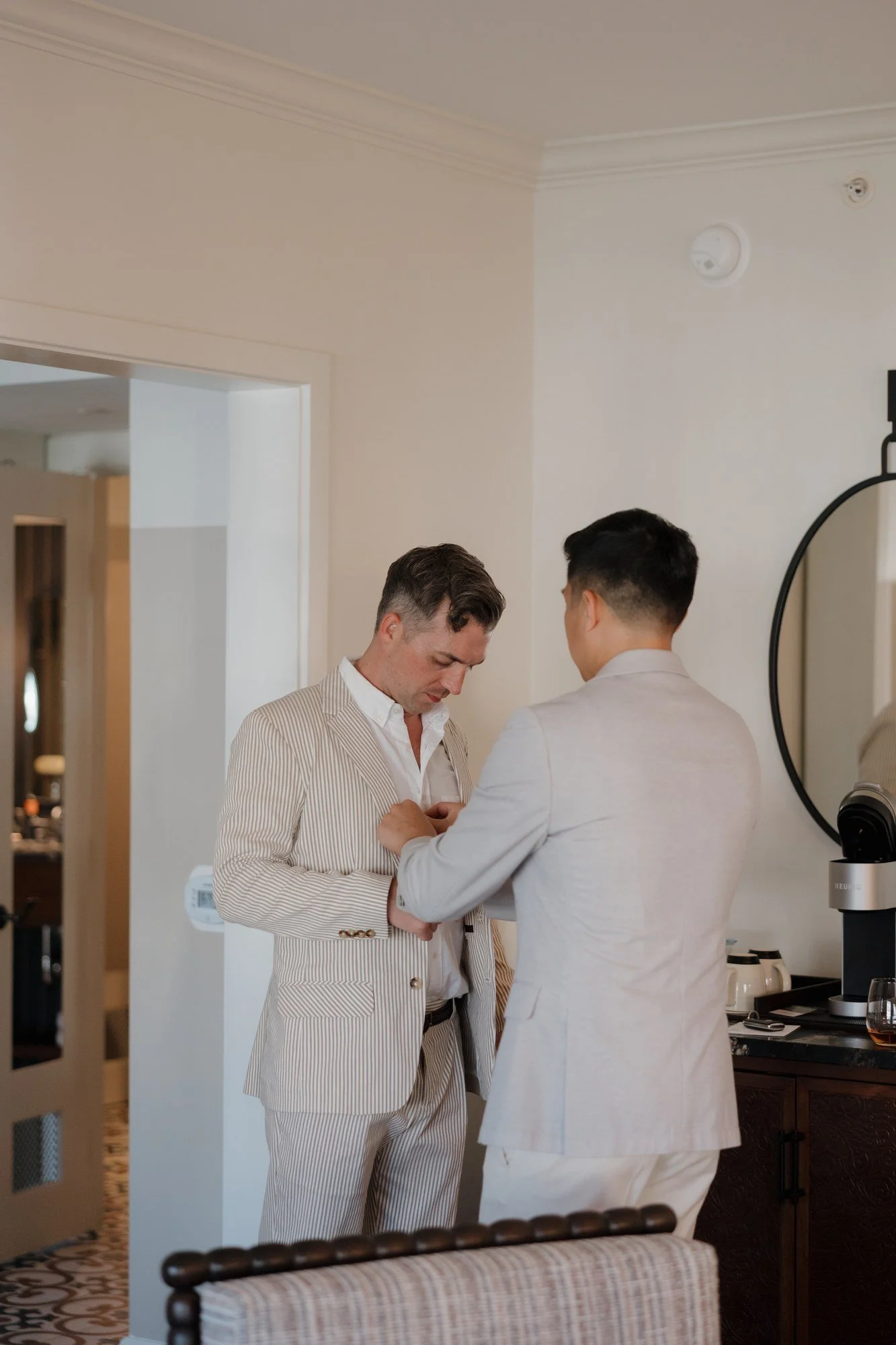 Ryan helping Sean with his jacket before the rehearsal dinner at Estancia La Jolla