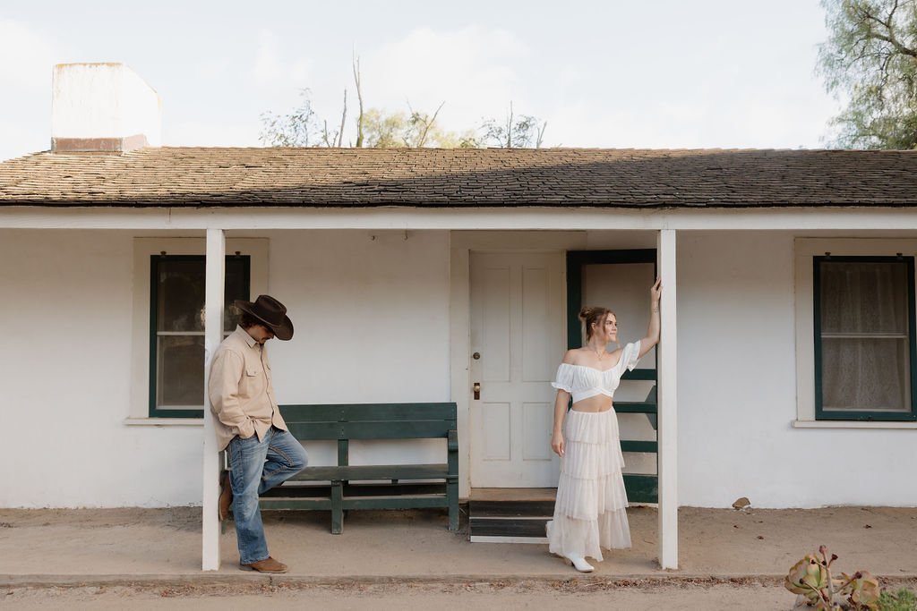 Couple on the porch of the historic Los Penasquitos Ranch House