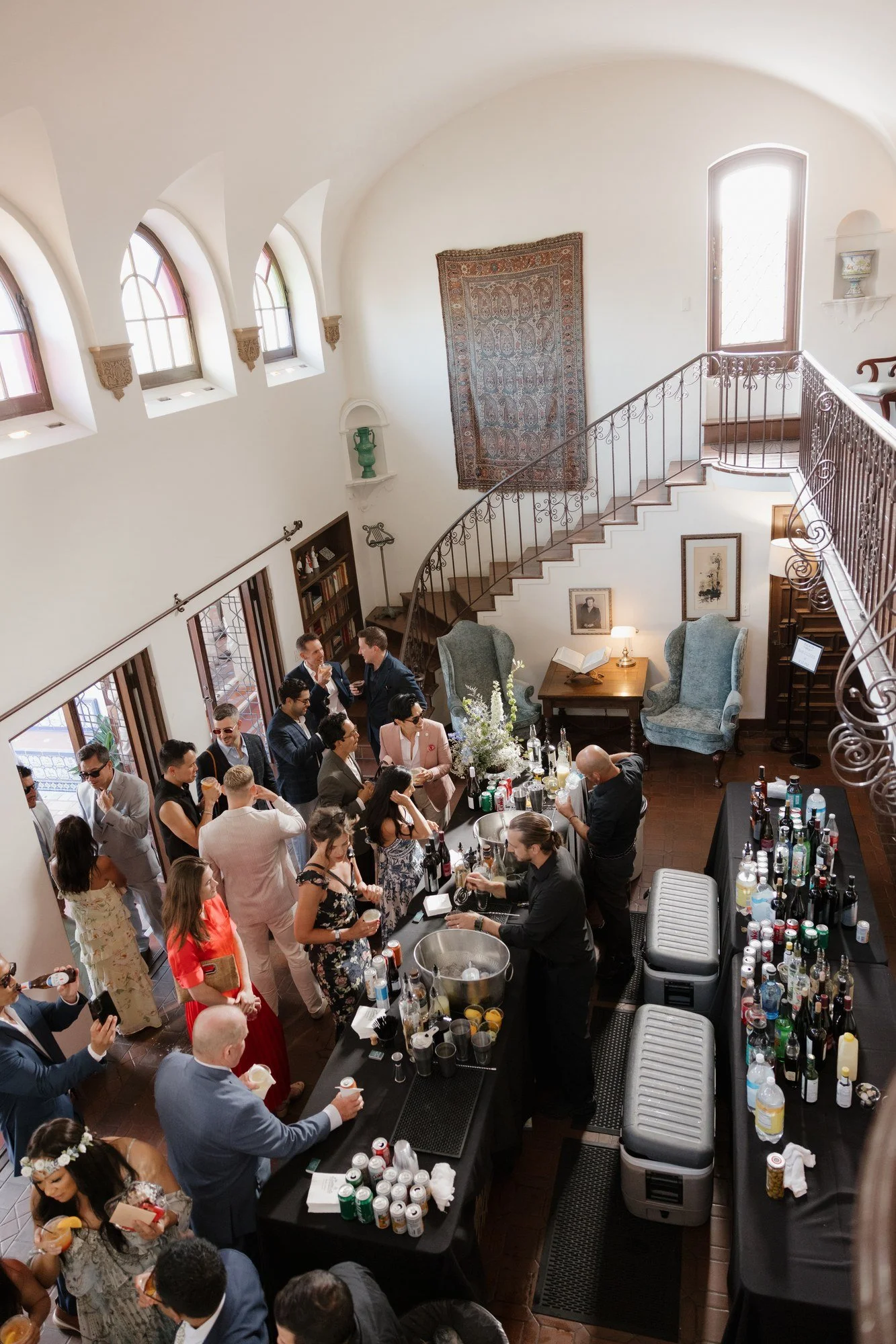 Overhead view of guests at the bar in the great room of Darlington House