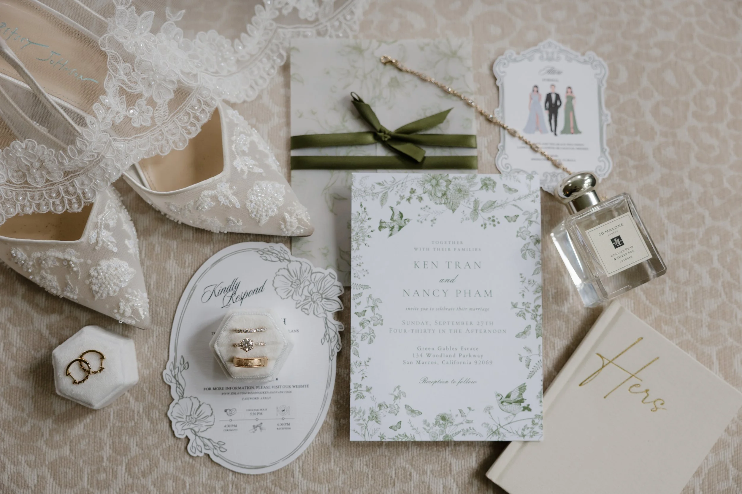 Nancy and Ken's wedding invitation suite with rings, lace heels and perfume at Green Gables Wedding Estate