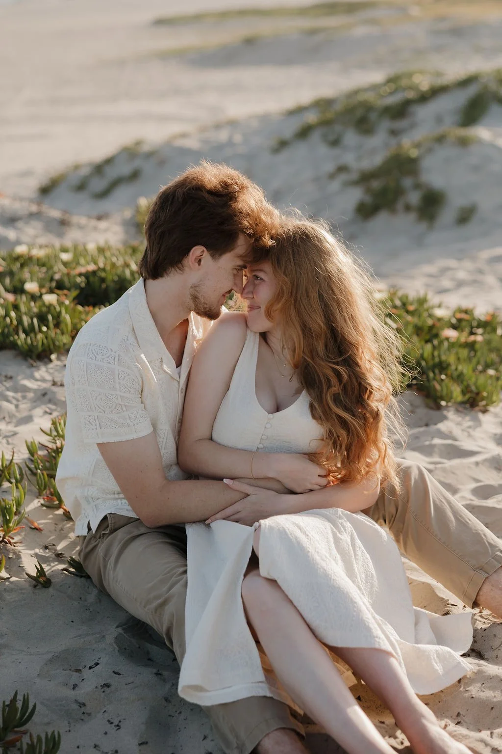 Candid cuddle in the sand dunes at Coronado Beach