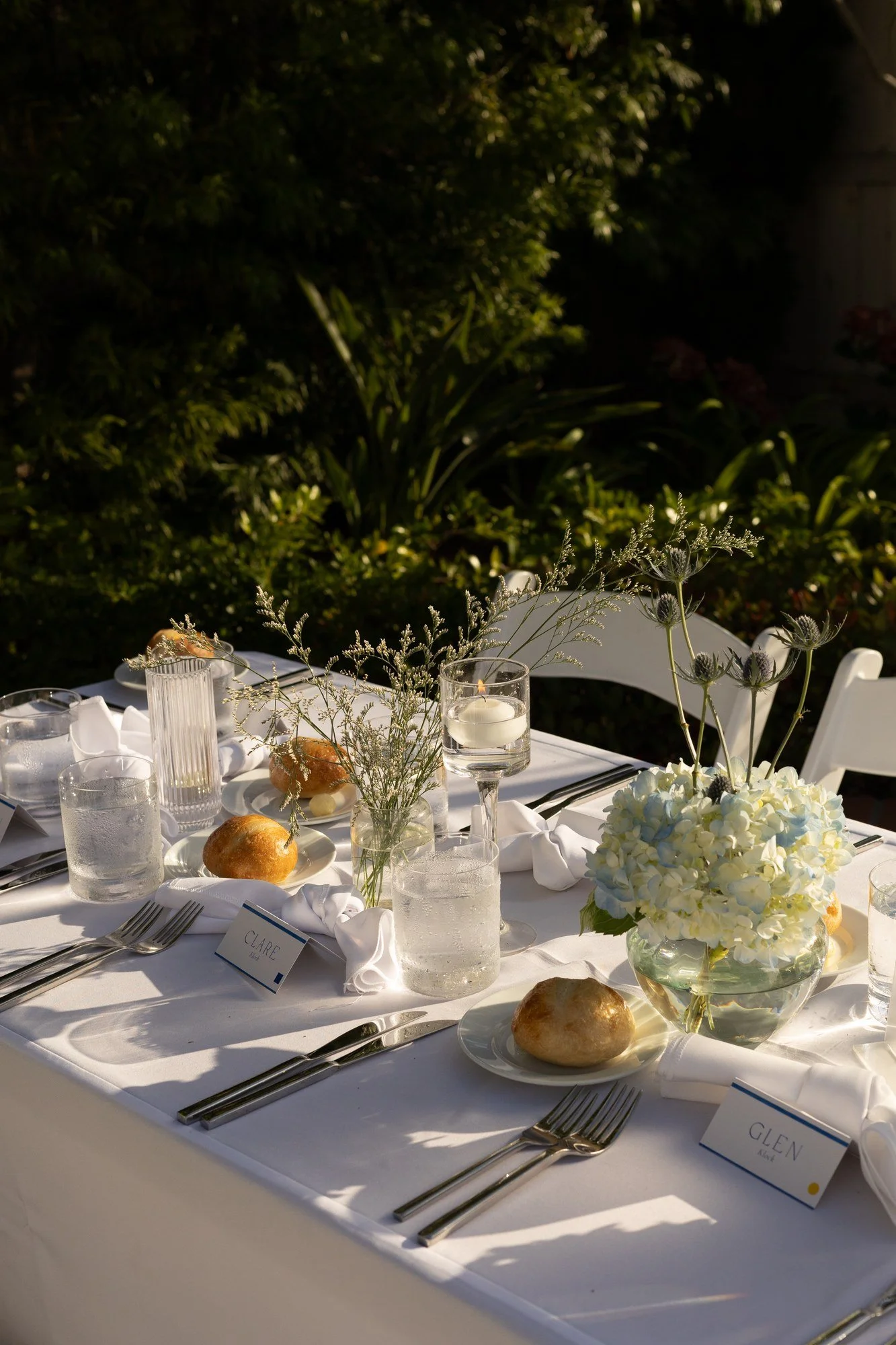 Wedding reception tablescape with greenery and white florals at Darlington House