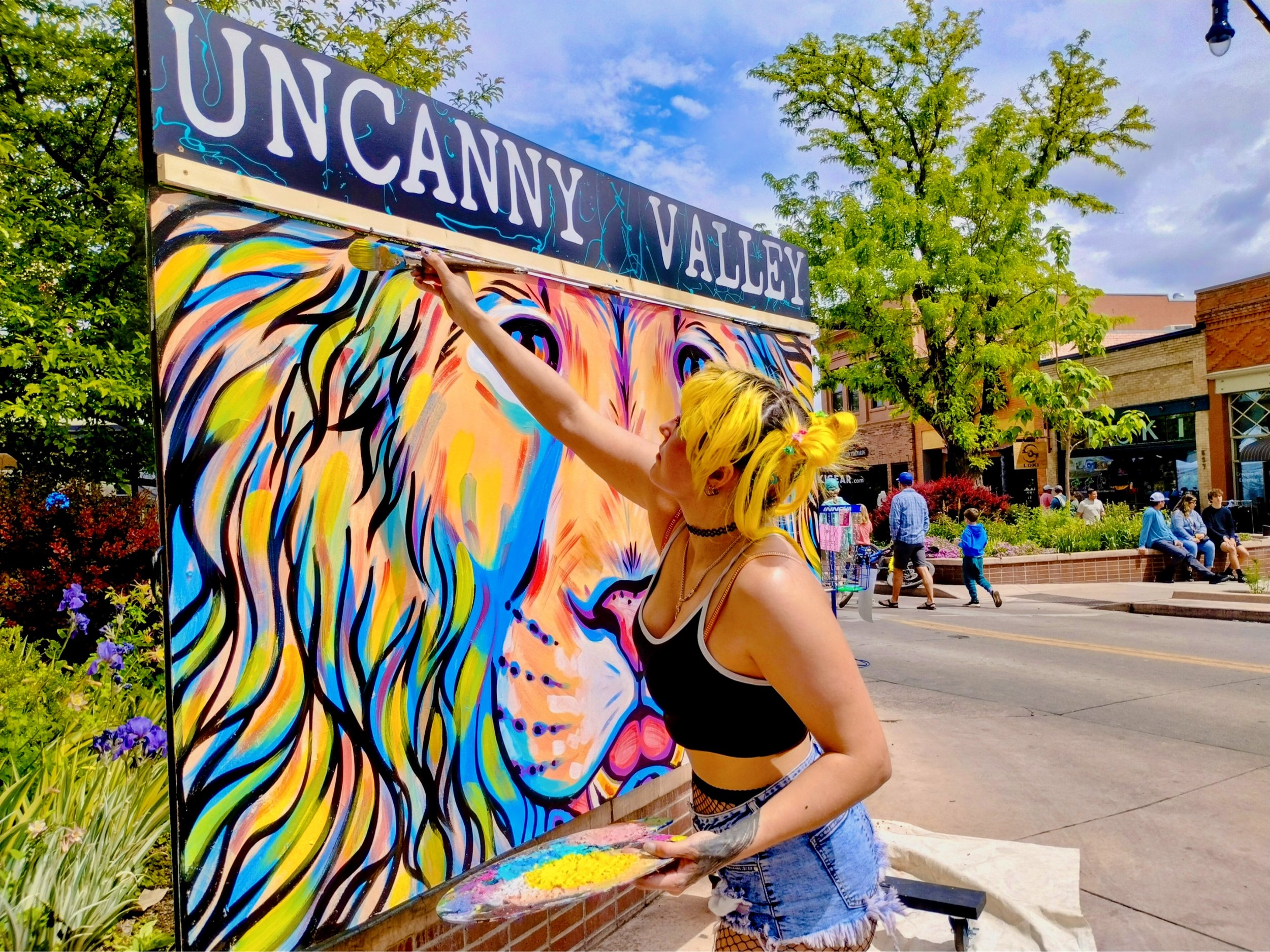 Live art demo during a downtown street festival.