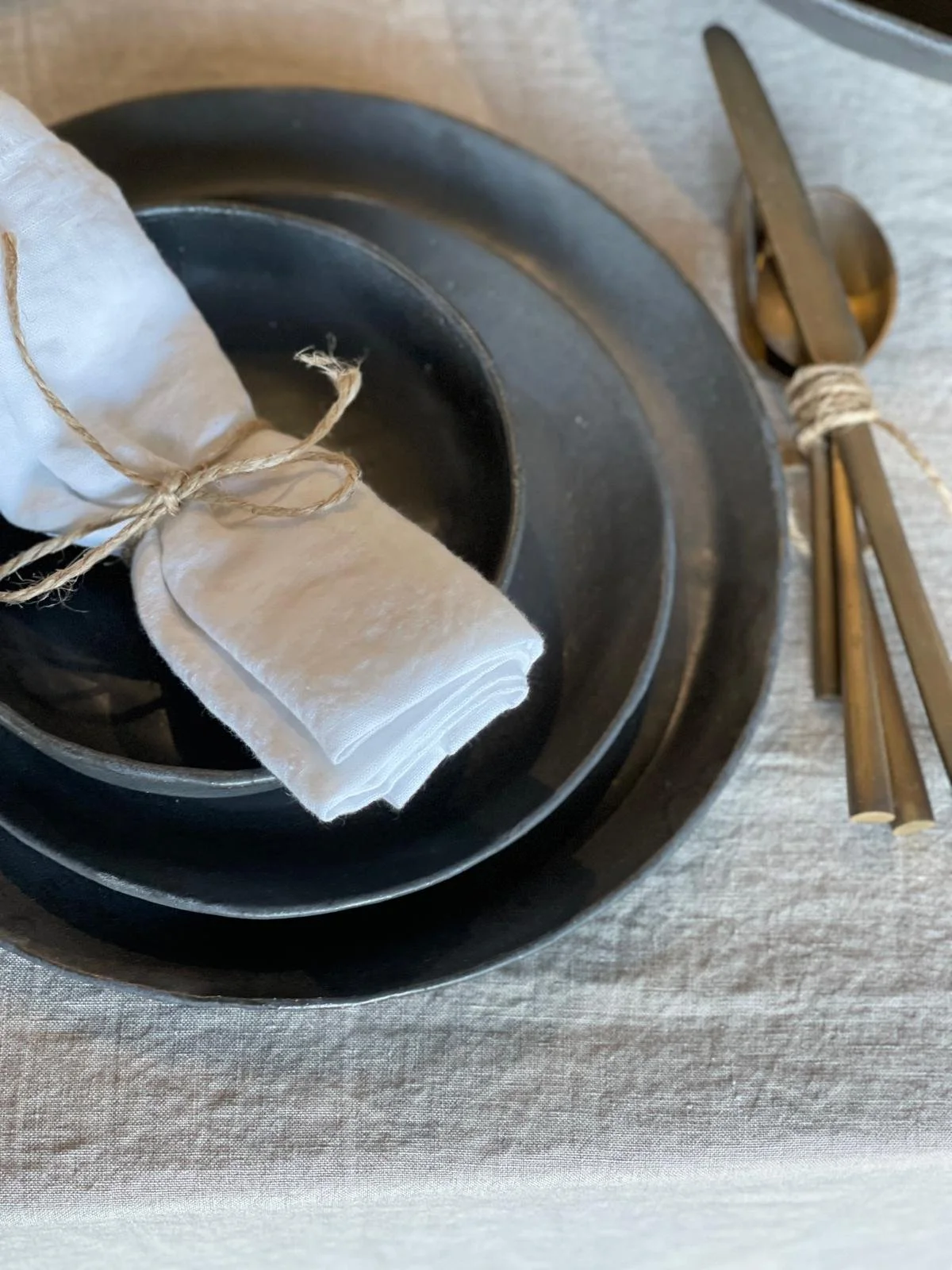 Charcoal Dinner Plate – 27cm handmade ceramic plate by Melissa Lellouche with a satin matte charcoal glaze and raw edge. Part of the Charcoal Collection.